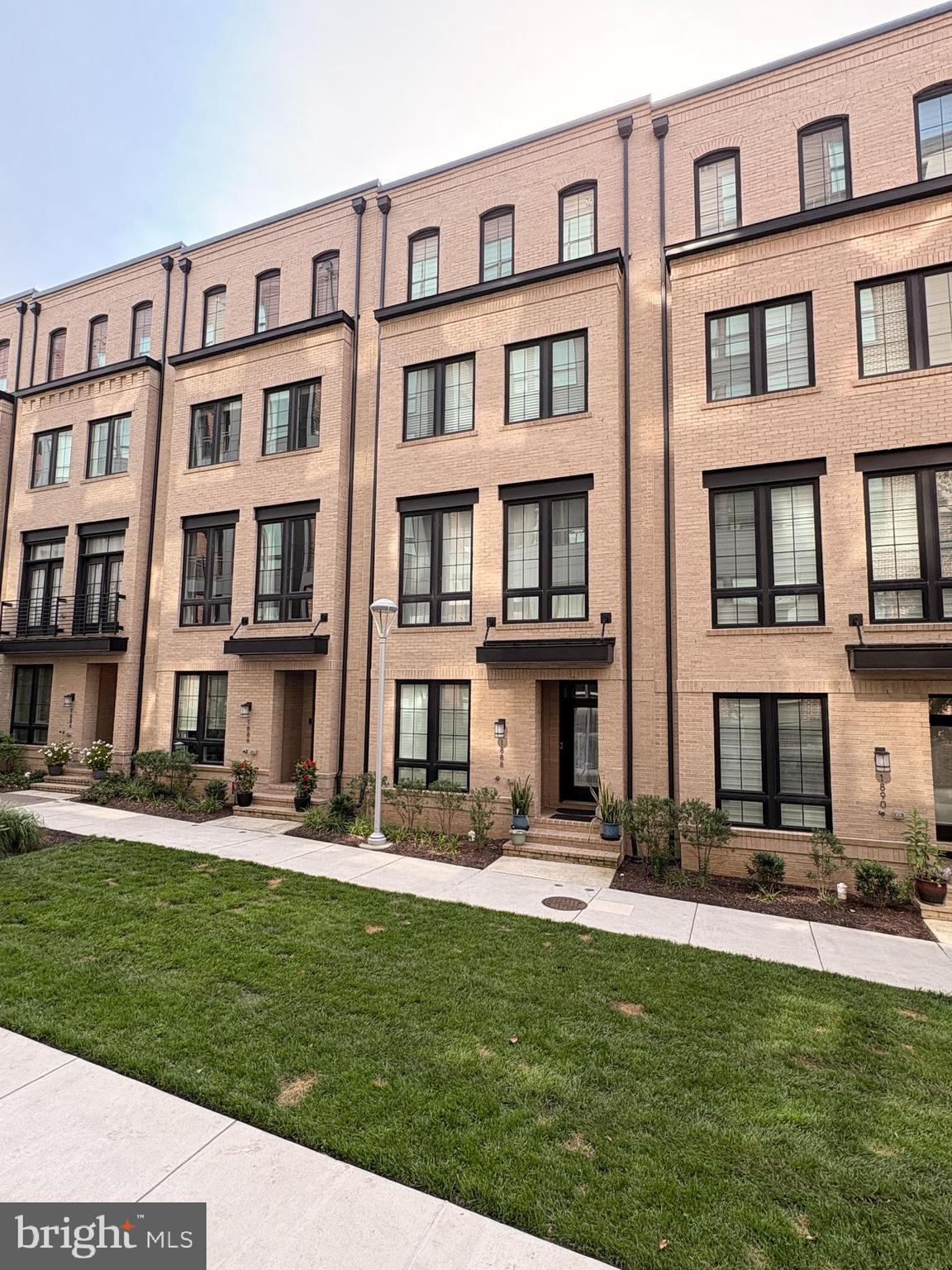 Don’t Miss this sophisticated 4-level townhome in desirable neighborhood just a short distance to the Wiehle/Reston Metro Station.  Featuring 4 en-suite bedrooms, this impressive home has had over $100k of capital improvements since 2024 including a gourmet kitchen with NEW cabinetry, NEW quartz counters & NEW premium appliances, built-ins galore to boost the storage overall and custom designed walk-in closets!  Showcasing hardwoods throughout, this bright & airy home provides a balcony off the main level as well as a rooftop terrace to expand your entertaining space!  Every bedroom has its own bathroom offering privacy and convenience and there is even a handy entry level bedroom and bath. Your guests can park for free in the parking garage a few steps from your front door and with shops & restaurants around the corner and the metro just 1.5 blocks away, this is luxury living at its best!  Make it yours TODAY!