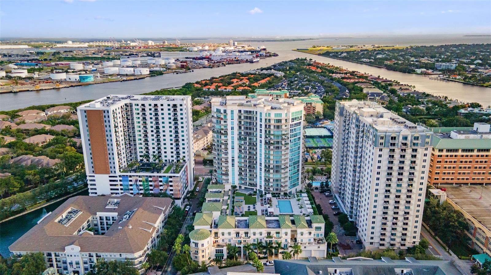 Under contract-accepting backup offers. Step inside and experience the essence of refined Harbour Island living in this casita style two story residence. Sunlight pours through soaring ceilings, filling each space with warmth and airiness. Two private balconies and a secluded patio blur the line between indoors and out, creating an elevated lifestyle that feels both effortless and serene. Every detail has been thoughtfully customized, from the open staircase with its sleek modern railing to the porcelain accent wall that anchors the living room with quiet elegance. The phrase that comes to mind when you experience this casita is “convenience by design.” Residents enjoy the ease of responsive concierge services, rentable guest suites for family and friends, and the rare privilege of on-site valet. This residence also offers two assigned parking spaces just steps from your door with no elevator required. Every element has been carefully curated to simplify daily living while maintaining an atmosphere of sophistication. Amenities of the building extend the lifestyle even further with a resort style pool and lounging deck, a fully equipped fitness center, private event and party space, and professional conference rooms. Together, these offerings create a setting where wellness, productivity, and leisure are all within easy reach. And then, there is the location. Just steps away, the best of downtown Tampa comes alive with fine dining, chic shops, and the vibrant energy of the city. Evenings can be spent strolling to Amalie Arena for Lightning games or catching world class concerts, all just beyond your doorstep. This is more than a home, it is a story of elegance and ease woven seamlessly together where thoughtful design meets the pulse of Tampa’s most coveted lifestyle.