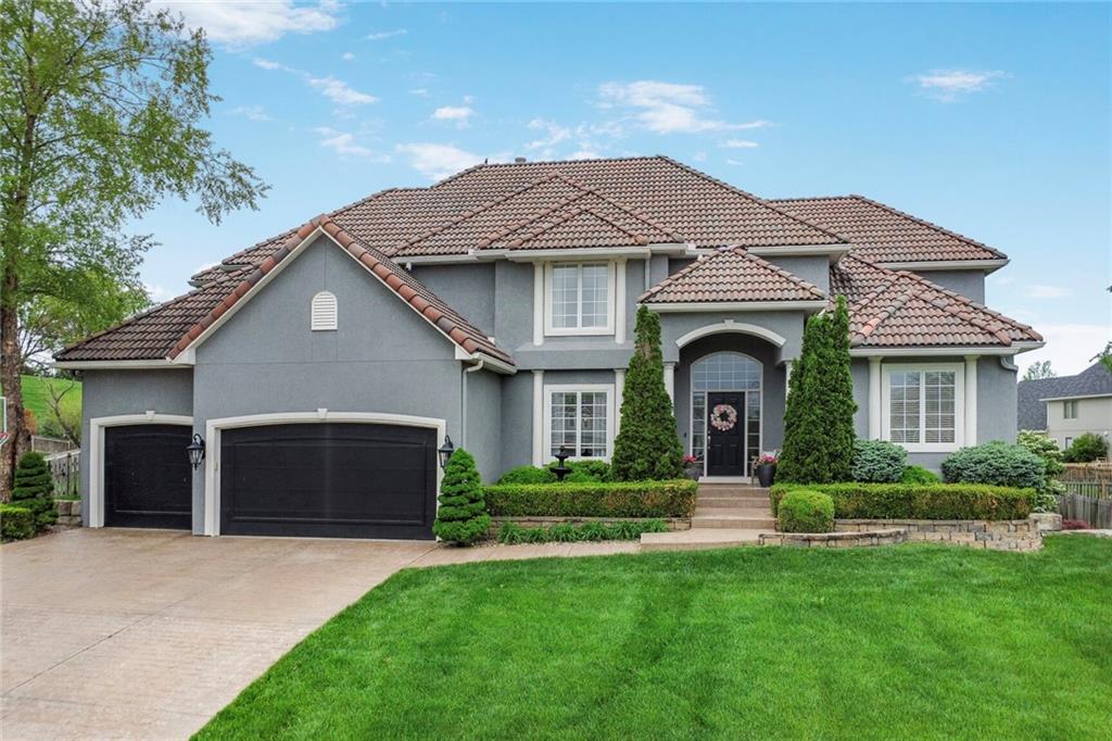Welcome to luxury living in the prestigious Lakewood community of Lee's Summit! This stunning 4-bed, 4.5 bath executive home is designed for both everyday comfort & effortless entertaining. The open floor plan seamlessly connects the gourmet kitchen, dining, & living areas, creating an inviting space where family & friends can gather with ease. The finished basement is a true highlight for sports fans & movie buffs, offering a spacious area to cheer on your favorite team or immerse yourself in a theater-like experience w/your favorite films—complete w/a charming playhouse niche tucked under the stairs for the kids, & an office w/ built-in desk.
The main-floor primary suite is a serene retreat, featuring a freshly remodeled spa-like bathroom & a custom-designed, functional closet. The remaining three bedrooms are generously sized, each w/ walk-in closets & direct bathroom access, ensuring comfort for all. Step outside to a breathtaking backyard oasis, where a gorgeous patio w/ an outdoor fireplace & lush landscaping creates the perfect setting for cozy evenings or lively gatherings. An in-ground sprinkler system keeps the yard pristine with minimal effort.
Living in Lakewood means embracing a resort-style lifestyle. Spend your days exploring scenic walking trails, relaxing at one of the community’s pools, or enjoying a game at the athletic facilities. The sparkling lake offers endless recreation—launch your boat from the docks, fish along the shore, or soak up the sun at the beach. Join vibrant clubs like the Sailing Club or Garden Club, or attend community events such as the 4th of July boat parade, fostering connections with neighbors who share your passions. In Lakewood, every day feels like a vacation, blending luxury w/ the joys of an active, engaged community.  With parks & playgrounds, Lakewood fosters a vibrant community spirit where neighbors become friends. This is more than a home; it’s a gateway to a life filled w/ leisure, connection, & natural beauty.