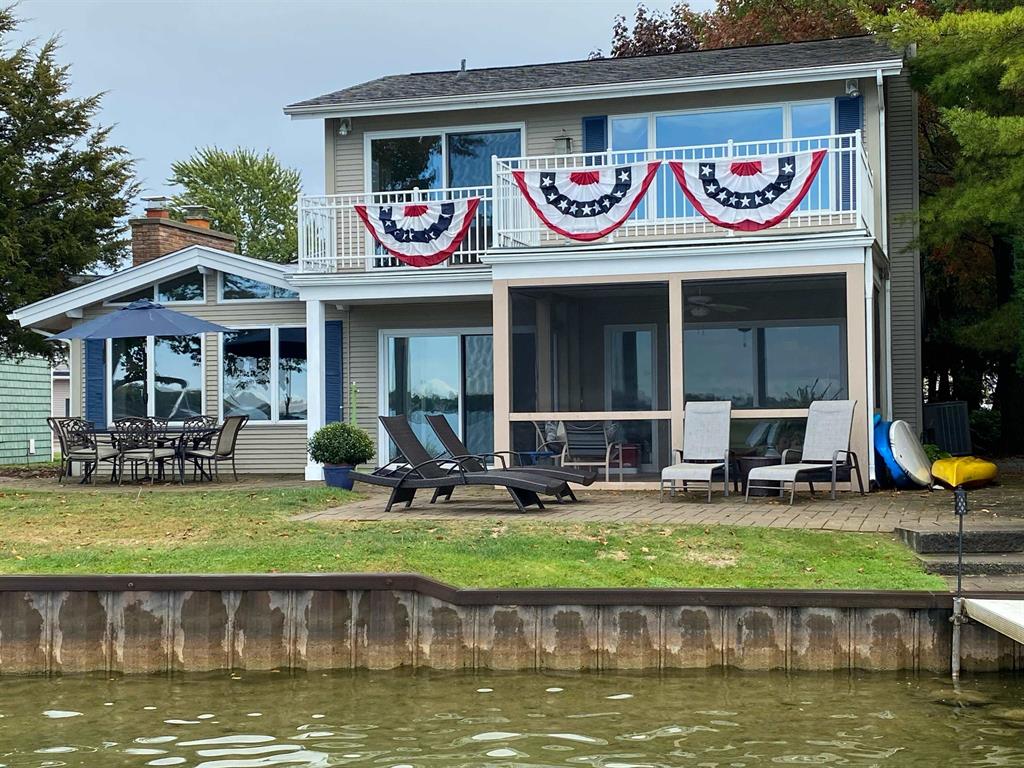 A true lake house where the water sets the rhythm of life. Nestled on Log Cabin Pointe, this 2,200 sq. ft. retreat captures the essence of Michigan lake living with sweeping views, cathedral ceilings, and walls of windows that frame the beauty of the water at every turn. Designed for both quiet mornings and lively weekends, the home features two fireplaces, a screened-in porch for summer evenings, and spaces that flow seamlessly from cozy nooks to open gathering areas. The primary suite is a serene sanctuary, complete with a sitting area, dual walk-in closets, bath, and a private deck that overlooks the lake-the perfect place to greet the sunrise or watch the day fade into twilight. With four bedrooms, two baths, and thoughtful design, the home lives effortlessly for two yet expands to welcome family and friends. Whether you're hosting long weekends, holiday gatherings, or simply enjoying the peace of lakefront living, this home offers the rare balance of comfort, flexibility, and timeless views. Just minutes from downtown Fenton's dining, shops, and year-round events, this property isn't just a house on the water-it's a true lake house where happy memories are made.