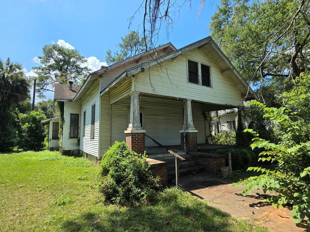 Welcome to a piece of Thomasville history! This charming historic home, nestled just moments from downtown, is brimming with potential for the discerning buyer ready for a renovation project. Step inside and be greeted by soaring high ceilings that create an inviting sense of space and light throughout the home. Original architectural details offer character and charm, begging to be restored to their former glory. Imagine sipping your morning coffee on the expansive front porch, where you can soak in the vibrant Victoria Park neighborhood while enjoying tranquil views it's beautiful surroundings. With ample square footage and large rooms, this property provides plenty of opportunities to design your dream living spaces. Situated near bustling shops, delectable dining options, and community events downtown, this location perfectly balances historic allure with modern convenience. Don't miss out on the chance to breathe new life into this magnificent residence! Whether you're an investor or looking for your forever home project, this house awaits your creative vision to transform it into a stunning masterpiece. Explore the possibilities today!