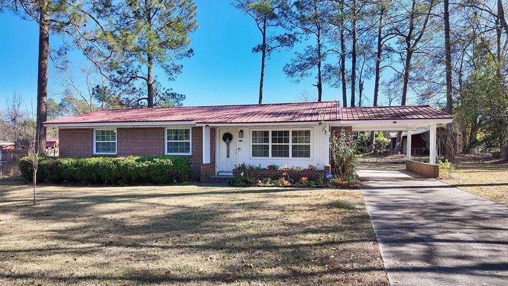 Location, Affordability, and Move-in Ready! Bring your vision to life in this space! Whether you're wanting a starter home or looking to downsize, this beautiful 3-bedroom, 1.5-bath home is the perfect opportunity. Enjoy convenient access to Publix, Lowe's, Archbold Hospital, shopping, and restaurants. Inside, the home features newer windows and a kitchen with a new stovetop and counters, along with a new dishwasher and washer/dryer. Outside, enjoy nearly half an acre of yard, an attached carport, and a utility shed with a carport. There is a septic tank on the property.