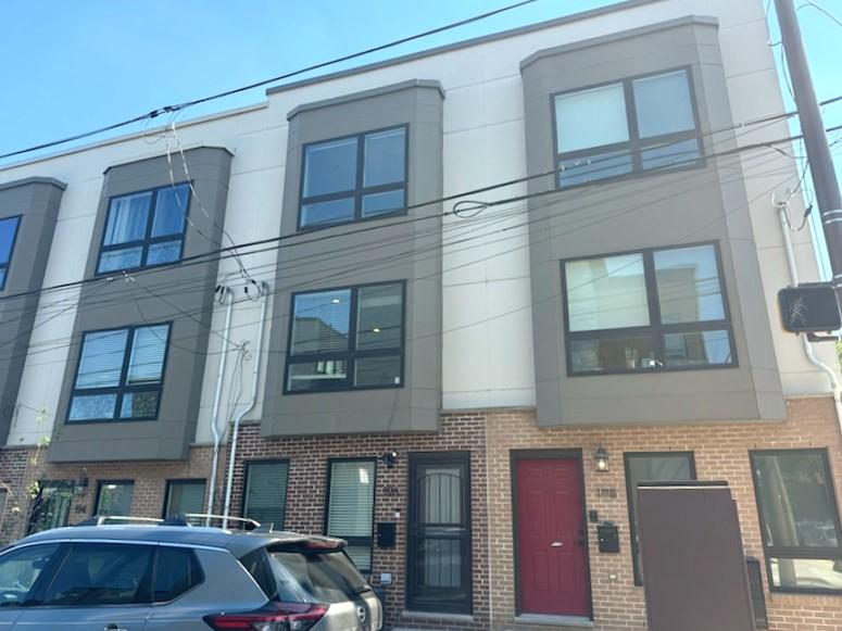 Nestled in the charming Olde Kensington neighborhood, this delightful townhouse offers a perfect blend of modern comfort and inviting warmth. Built in 2019 and starting at the entry way with laundry closet & inside access to the garage. The main of this home features an open floor plan that seamlessly connects the living, and kitchen areas, creating an ideal space for both relaxation and entertaining + a powder room is on this level. Step inside to discover beautiful hardwood and ceramic tile flooring that enhances the home's elegance. The kitchen is a chef's dream, equipped with stainless steel appliances, quartz counters, c/t backsplash, a built-in microwave, dishwasher, and gas oven/range, along with a cozy eat-in area perfect for casual meals. The spacious living area is bathed in natural light, accentuated by recessed lighting, making it a welcoming retreat. With two well-appointed bedrooms, including a primary suite with a walk-in closet, this home provides ample space for comfort and privacy. The full bathroom features a double vanity & tub shower, offering a serene spot to unwind after a long day. Outside, enjoy the convenience of an attached garage with inside access and driveway parking, along with beautifully designed exterior lighting and sidewalks that enhance the neighborhood's charm. A roof deck provides a perfect vantage point for enjoying the outdoors. With low association fees that include snow removal, and with the10 year Tax Abatement still in place this home is not just a residence; it's a lifestyle. Experience the perfect blend of modern living and community charm in this inviting townhouse.