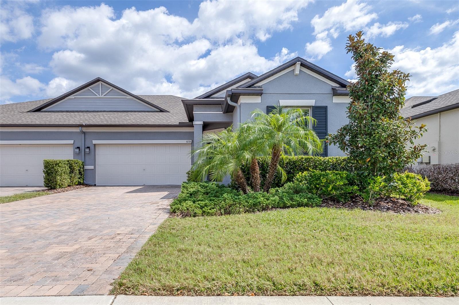 Beautifully upgraded and ideally positioned on a peaceful pond and conservation view, this 2022-built Connerton villa offers the kind of easy Florida living that is hard to find. With 3 bedrooms, 2 full baths and 1,968 square feet, this thoughtfully designed home combines an open great-room layout with stylish finishes, smart upgrades and a serene outdoor setting.The kitchen is the heart of the home, featuring 42-inch cabinetry with pull-out shelving, quartz countertops, a breakfast bar, walk-in pantry, pendant lighting over the island and a NEW LG refrigerator. A reverse osmosis water filtration system adds another layer of convenience. Throughout the home, plantation shutters provide timeless style and privacy, while oversized tile flooring in the main living areas and luxury vinyl plank flooring in all bedrooms mean NO CARPET.The spacious primary suite offers a true retreat with a large walk-in closet featuring a built-in organization system and a beautifully appointed ensuite bath with dual quartz vanities, walk-in shower and a NEW luxury shower door.Step outside to the screened, brick-paver lanai and enjoy tranquil pond and conservation views with no need to sacrifice privacy or outdoor living. Additional upgrades include crown molding, 5 1/4-inch baseboards, ceiling fans throughout, a brick-paver driveway, garage storage and an EV charger in the 2-car garage.And then there is the Connerton lifestyle. Residents enjoy resort-style pools, splash park, fitness center, tennis and pickleball courts, parks, miles of trails and community gathering spaces. With easy access to US 41, SR 54, shopping, dining and Tampa-area destinations, this is more than a beautifully upgraded villa. It is a move-in-ready home designed for enjoying Florida life.