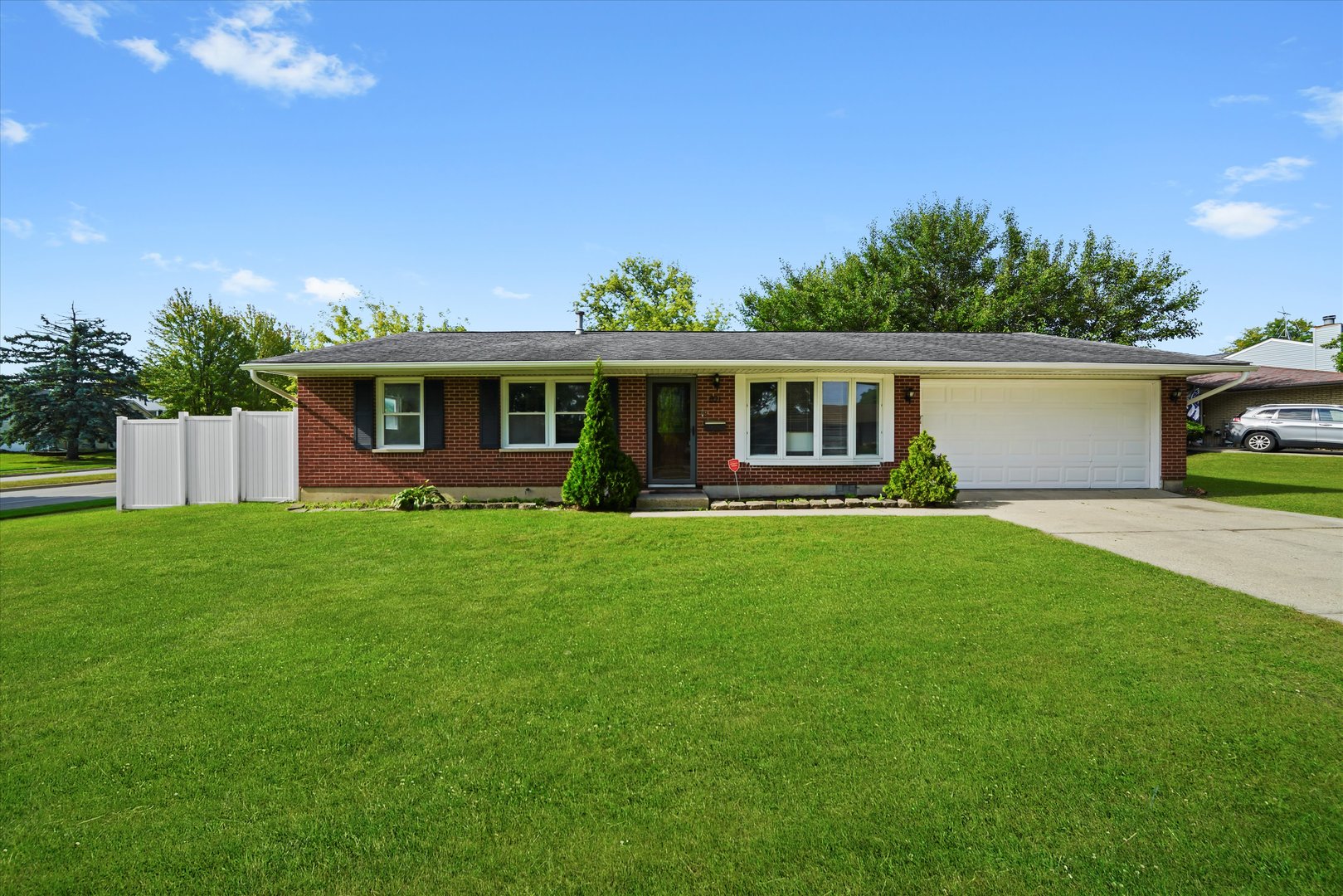 Beautifully updated 3-bedroom, 2-bath ranch on a spacious corner lot with a park right across the street. This move-in-ready home offers updated plumbing and electrical, an attached garage, and a modern kitchen with new shaker cabinets, stainless steel appliances, ample counter space, and designer finishes that open to a bright family room with vaulted ceilings, skylights, and recessed lighting. Spacious bedrooms, stylishly renovated baths, and a large fenced private backyard make this home perfect for comfortable living, all while being conveniently located near parks, schools, and shopping.