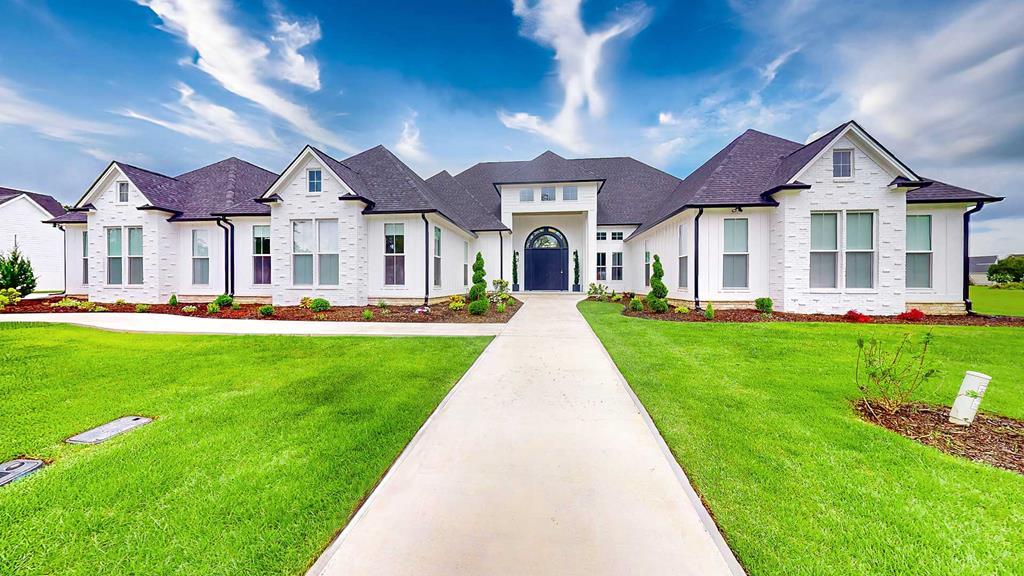 Welcome to 347 Madison Grove Blvd., a home where everyday life feels like a luxury retreat. From the moment you step through the grand double doors into the soaring foyer, you'll know this is more than a house — it's a lifestyle.  Imagine mornings by the double-sided fireplace, coffee in hand as sunlight pours into the den, or slipping into the home office for a quiet, productive day. In the evenings, the chef's kitchen becomes the heart of the home — double islands, quartz counters, and commercial-grade appliances make everything from weeknight dinners to holiday gatherings effortless.  When it's time to unwind, the theater room with its own full kitchen and ice maker sets the stage for family movie nights, lively game days, or casual evenings with friends. And when guests come to stay, they'll each have their own private retreat — every bedroom has its own bathroom and walk-in closet.  The primary suite is a world of its own: custom his-and-her closets, dual toilets, a spa-inspired shower, and a soaking tub that makes every day feel like a trip to the spa. Even the details make life easier — a three-car garage with finished touches, double laundry hookups, a drop zone for daily essentials, and bonus storage above the garage.  Step outside, and the lifestyle continues. The covered back porch is perfect for morning coffee, weekend cookouts, or unwinding at the end of the day. And with plenty of space to add a swimming pool, the backyard is ready to become your own private resort.  All of this is tucked inside Madison Grove,  one of Thomasville's most beautiful neighborhoods — where kids ride bikes down tree-lined sidewalks, neighbors wave hello, and families gather at the clubhouse or pool.  If you've dreamed of a home that blends elegance with ease, where every detail has been thoughtfully designed, and where life feels both indulgent and inviting, 347 Madison Grove Blvd. is waiting for you.