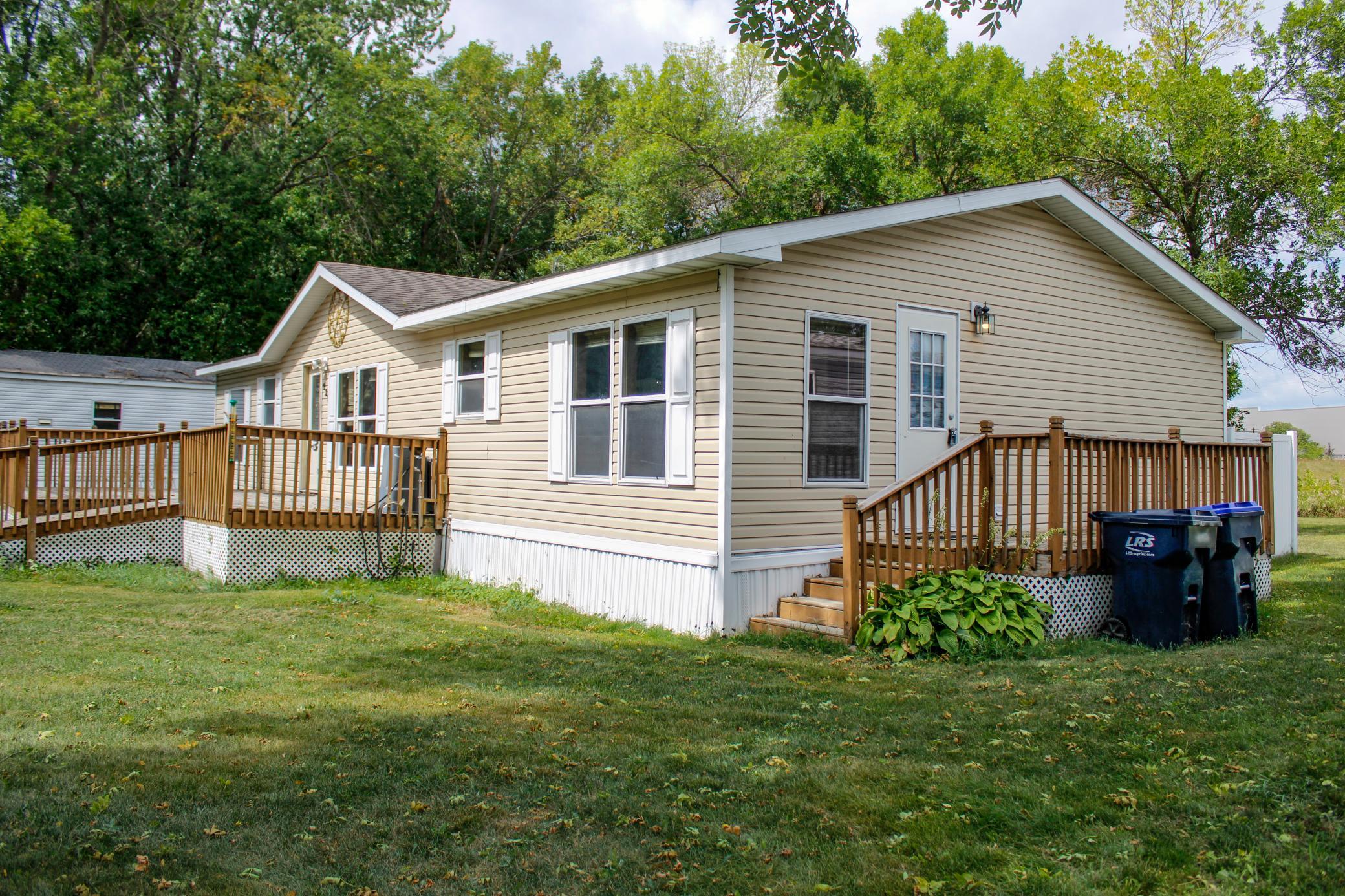 Welcome to this updated 3-bedroom, 2-bathroom double-wide home in The Meadows MHC, situated on one of the larger lots within the community with an open setting and no home directly behind you. Fresh paint throughout gives the interior a bright, refreshed feel, while the open layout creates an easy flow between the main living spaces and plenty of room to settle in and make it your own.Step outside and you’ll find even more space to enjoy, starting with the large 25x14 front deck andaccessibility ramp that provides easier entry into the home. Out back, the open grassy area behind theproperty creates additional breathing room and a more private feel, with a fire pit ready for eveningsoutside. The primary suite adds a unique convenience for pet owners, with a doggy door leading directly from the primary bathroom into a private 16x6 fenced pet area. A storage shed with electricity provides additional space for tools, hobbies, or storage, while central heat and A/C, supplemental window A/C in the primary bedroom, and a two-car parking pad round out the home’s practical features.Located just minutes from Monticello shopping, dining, and major routes, this is a rare opportunity toenjoy one of the community’s larger lots with the space and flexibility to truly make it your own. Cometake a look and see what this home has to offer!