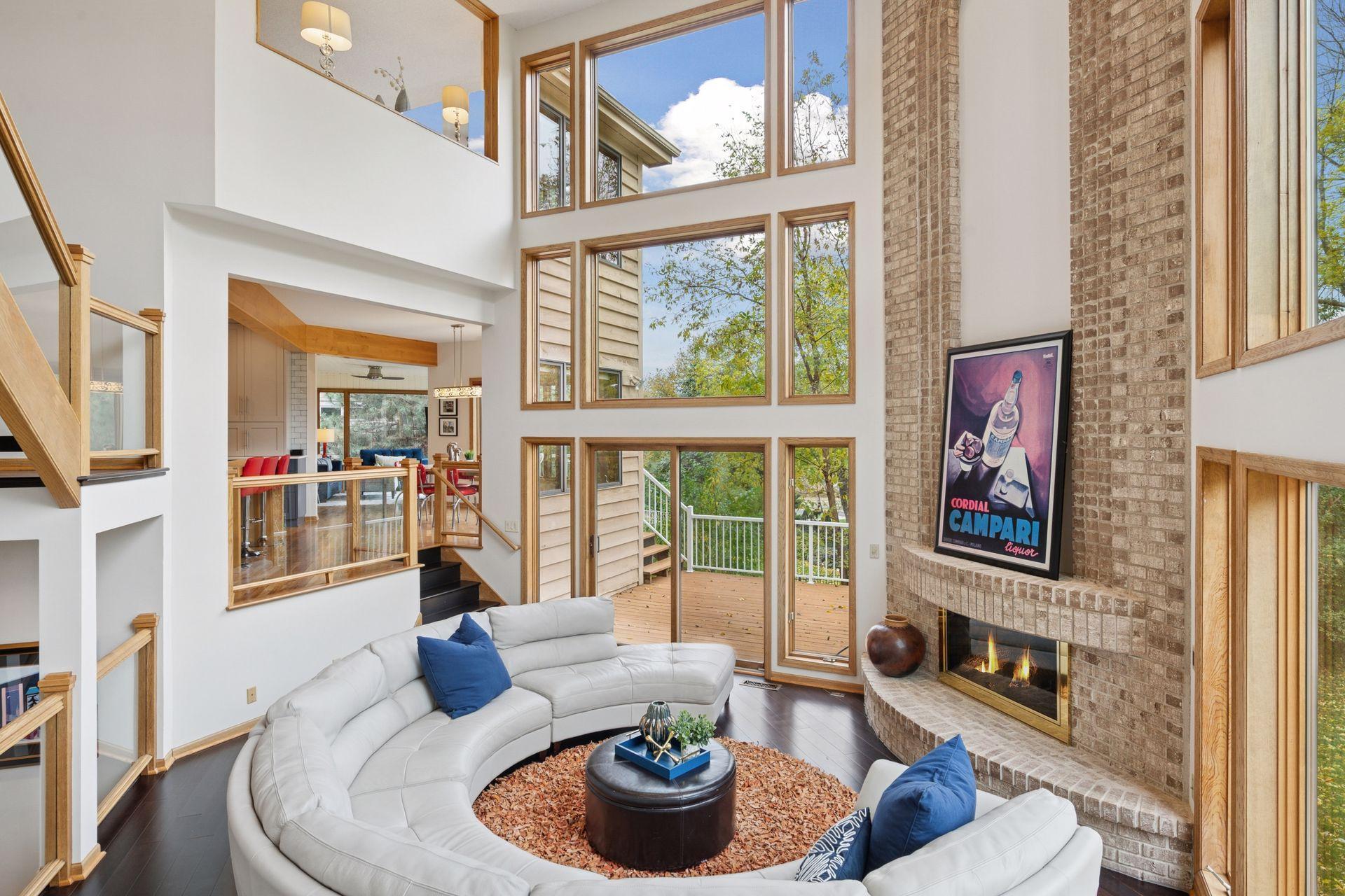 Entertainer’s Dream in Scenic West BloomingtonWelcome to a home designed for living beautifully and entertaining effortlessly. Perfectlypositioned in the heart of West Bloomington’s scenic landscape, this residence captures theessence of refined living surrounded by nature. Just minutes from Bush Lake Park, HighlandPark Reserve, and miles of wooded trails, it’s an exceptional setting for those who value bothluxury and lifestyle. The expansive main level offers a natural flow that encouragesconnection—whether it’s an intimate family gathering or a full-scale celebration. The chef’skitchen is the heart of the home, featuring high-end appliances, generous prep space, anabundance of custom cabinetry and a large center island perfect for conversation and casualdining. Just beyond, the four-season porch provides the ideal spot to enjoy morning coffee or anevening glass of wine overlooking the private backyard. The open layout includes a formaldining room perfect for hosting dinner parties, with a comfortable living room just off to theside—a welcoming space to visit and unwind. At the center of it all is a stunning two-story greatroom with a cozy fireplace,expansive windows and soaring ceilings. Open to all areas of thehome, it’s the ultimate gathering space to relax, read, or connect with family and friends.Upstairs, you’ll find four bedrooms, including a spacious primary suite designed for comfort andstyle. The primary retreat features a personal deck, an expansive spa-like bath with doublesinks, jetted tub, walk-in shower, and private commode, plus a large walk-in closet with awindow that fills the space with natural light. A unique interior window looks out over the two-story great room, bringing even more sunlight into the suite. Three additional bedrooms share aconvenient Hollywood bathroom, making the upper level perfect for family or guests. Thewalkout lower level is an entertainer’s paradise. Enjoy a private wine tasting in the custom winecellar, relax in the adjacent tasting room, or watch a movie in the impressive eight-seat theater.After a workout in the home gym, unwind in the sauna for a spa-like finish. The expansivebackyard offers endless possibilities—ample room for a future pool, outdoor kitchen, or lushgarden retreat. Just for our Minnesota winters, enjoy an insulated and heated 3 car garage! Thoughtfully designed and impeccably maintained, this home blends elegance,comfort, and function in every detail. Experience the best of West Bloomington living—wheremodern luxury meets timeless design, and every day feels like a special occasion.