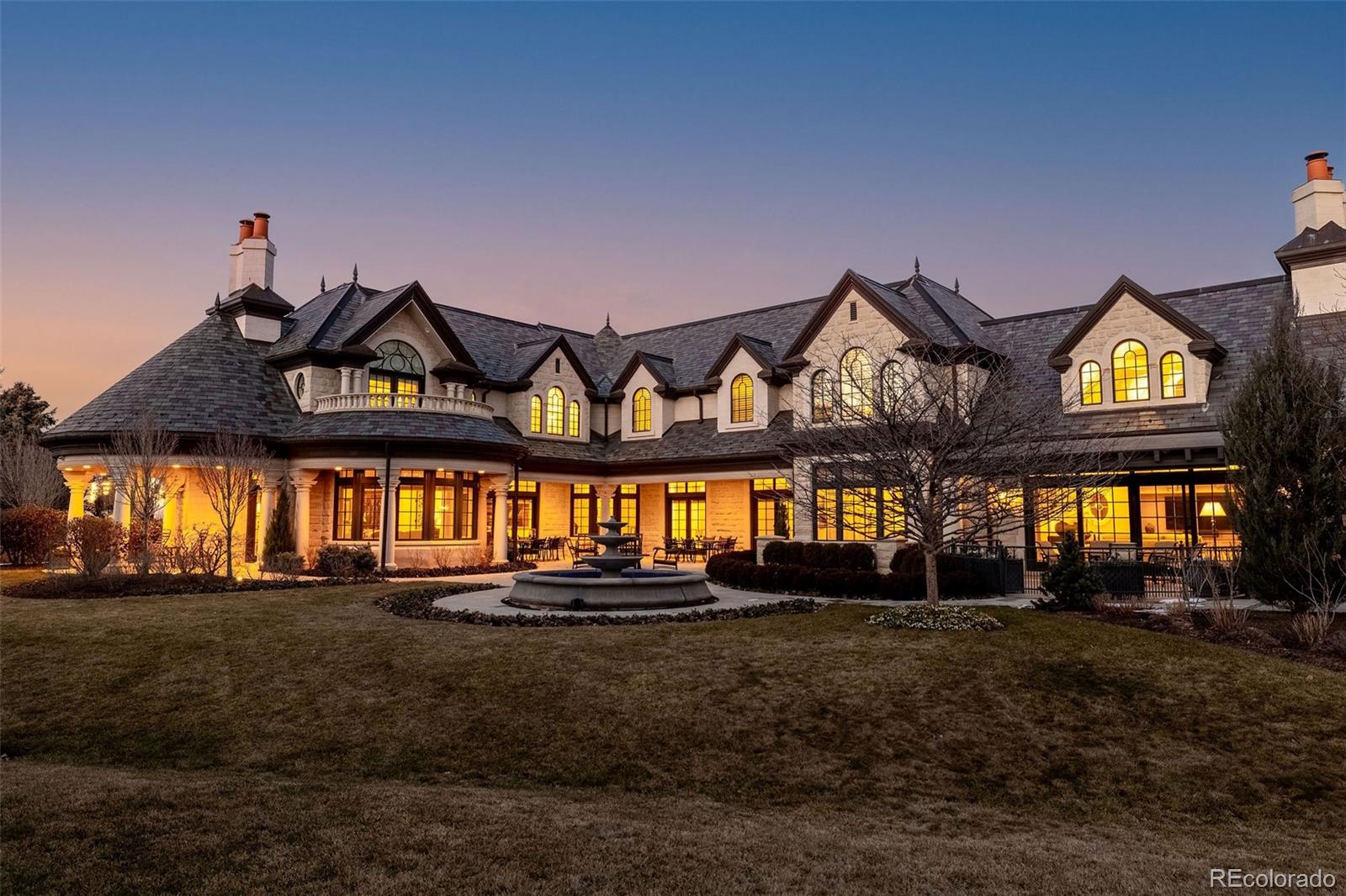 Located within the prestigious, guard-gated Cherry Hills Park community, this exceptional estate offers timeless elegance, privacy, and refined luxury on approximately 2.4 acres of beautifully landscaped grounds. Designed for both grand entertaining and comfortable everyday living, the residence spans roughly 12,075 square feet and includes 5 bedrooms, 8 bathrooms, and two 2-car garages connected by handsome porte-cochere.The home features a thoughtfully designed floor plan with formal living and dining rooms, inviting gathering spaces, and seamless indoor-outdoor connections. A standout upgrade is the custom Mick De Giulio gourmet kitchen, including one-of-a-kind German pounded silver hood and hardware plus elegant gold leaf cabinetry, combining quality craftsmanship with high-end appliances and functional beauty. The primary suite is a private retreat with a spa-inspired bath and dual custom closets, while secondary bedrooms are generously sized with en-suite baths. Additional interior highlights include vaulted ceilings, a flexible upper-level loft space, and beautifully appointed finishes throughout.  A hydraulic elevator servicing all three levels adds convenience and accessibility.Designed for lifestyle and wellness, the home includes an indoor putting green with precise two-degree slope, fully equipped fitness center with custom built, infrared sauna, and multiple entertainment spaces. Outdoor amenities are equally impressive, featuring multiple lush gardens, fountains, a bocce ball court, hot tub, and expansive patios ideal for hosting gatherings or enjoying peaceful evenings.Recent and notable upgrades include an integrated state-of-the-art security system, extensive custom millwork, refined architectural details, and meticulously maintained landscaping. Combining classic architecture with modern luxuries, this rare Cherry Hills Village estate offers an unparalleled living experience in one of Colorado’s most coveted neighborhoods.