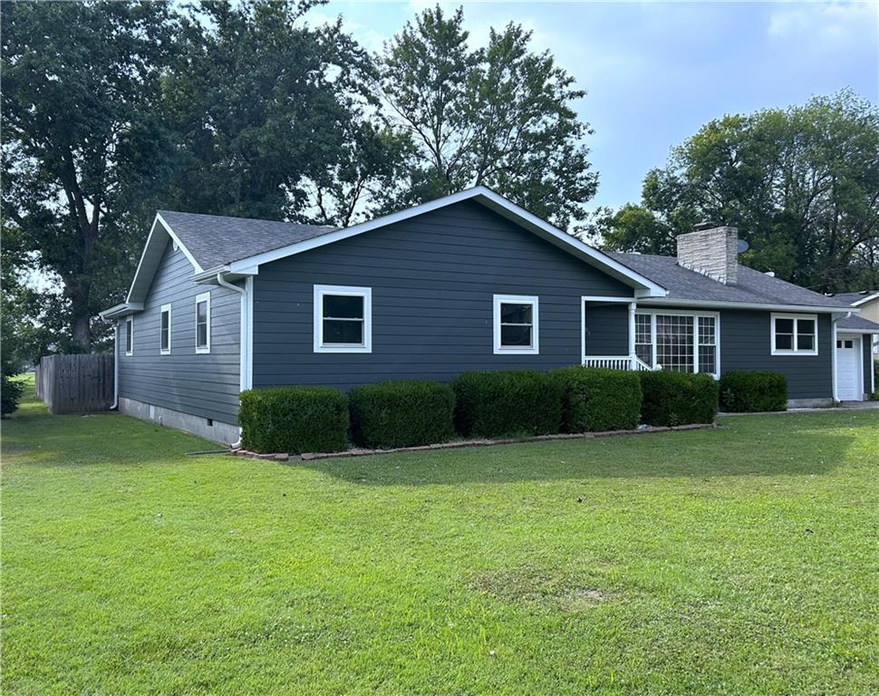 What an amazing opportunity to buy this beautiful 4 bedroom home, located in an area where neighbors describe it as, "the best area they've ever lived in!" This one level home feels like new, but for a lower cost than building. The renovations have been completed & only a few things left to do, such as adding your name to the mailbox. As you pull up, your eye is drawn to the modern, sleek, color of the home.  Not only does the sharp color have the wow factor, but the new eco friendly fiber cement siding offers a transferrable warranty to protect against weather damage & is resistant to fire & pests. The color is engineered to resist against chipping, peeling, cracking or fading.  You'll love this maintenance free siding, along with new gutters, soffits, downspouts & privacy fencing. Park in the attached garage & once inside, you'll be in awe by the new wood plank flooring throughout the majority of the home, new lighting, paint colors & sleek design.  The bathrooms have been renovated using modern design & a new efficient Heating & Air system was recently installed for cost savings. A potential 2nd Master Bedroom, with retro originality, is located along the back section of the home, with an ensuite new full bath, laundry & private patio access.  The 2nd family room is perfect to spread out for movie night with friends. The original blonde hardwood floors are present in 3 of the bedrooms, allowing for the blending styles of antique & modern chic decor. If you love to cook, you'll be drawn to the spacious kitchen with white painted cabinetry, original custom ginger trim, a farm-style deep sink, black marble counters accented with white subway tiles, all new black & stainless appliances making it a kitchen fit for a queen! Overflow & entertain off the kitchen area onto the expanded back patio for BBQ's & make memories together roasting marshmallows around the back yard firepit. This is an absolute must see when you're looking for space, beauty & home upgrades galore!