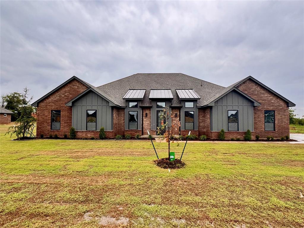 FEATURED HOME IN UPCOMING PARADE OF HOMES! This showstopper will be featured in the Parade of Homes so it is a MUST SEE! Plus, this community is a Shop Approved HOA! Stunning new construction in Blue Ridge Estates! This expansive Gramercy plan offers 4 spacious bedrooms, 3.5 baths, and over 3,200 sq ft of elegantly designed living space on over 1/2 acre (mol) lot. The impressive open layout is accented by cathedral ceilings, wood-look tile flooring, and a floor-to-ceiling stone fireplace in the great room. Enjoy a chef-inspired kitchen complete with quartz countertops, custom cabinetry, walk-in pantry, Samsung built-in appliances, vented wood hood, trash drawer, and under-cabinet lighting. The luxurious primary suite features a tech nook, spa-like bath with freestanding tub, doorless tiled shower, enclosed water closet, and a walk-through closet connecting to the utility room. Additional highlights. Private study with large windows/ Versatile flex space and seasonal storage. Mud bench off garage entry. Full sliding door that opens up to the Covered back patio ideal for entertaining. Ecobee smart thermostat, video doorbell, Wi-Fi enabled garage opener, and USB outlets Closing costs covered with preferred lender! Located minutes from HWY 9, I-35, and key OKC destinations, this home blends country living with metro convenience. Estimated completion soon—secure your future home today!
