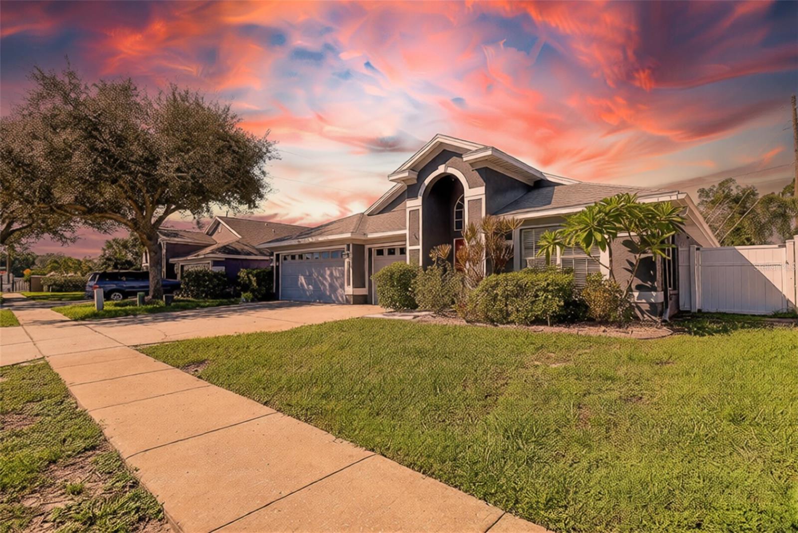 Virtually Staged. A PRIVATE POOL RETREAT IN THE GATED NORTH LAKE COMMUNITY!Discover the perfect combination of Florida living, privacy, and an exceptional location in the desirable North Lake community of Tarpon Springs! From the moment you enter, you'll appreciate the inviting atmosphere, impressive vaulted ceilings, beautiful wood flooring, and thoughtfully designed floor plan that offers both spacious gathering areas and private retreats.Designed with entertaining in mind, the heart of this home brings together a beautifully updated kitchen and an expansive family room, creating the perfect setting for everything from casual mornings to memorable evenings with friends and family. The kitchen features stunning granite countertops, a stylish stacked tile backsplash, breakfast bar, generous pantry storage, and a welcoming dining area.The spacious primary suite is a getaway of its own, featuring a separate sitting area, walk-in closet, and beautifully bathroom with dual granite vanities, a relaxing Jacuzzi soaking tub, and separate walk-in shower. With four bedrooms and a desirable split floor plan, this home offers versatility for a variety of lifestyles. Two secondary bedrooms share a conveniently located bathroom, while the fourth bedroom, situated near the pool bath, provides an ideal space for guests, a private office, or a hobby room.BUT THE FLORIDA LIFESTYLE DOESN'T STOP INSIDE! Step outdoors and discover your own private tropical escape! Surrounded by lush landscaping, the sparkling swimming pool sets the stage for sun-filled afternoons, weekend gatherings, or peaceful evenings unwinding in your own backyard. The screened pool enclosure was installed in 2020, and the pool was freshly resurfaced in 2025, making this outdoor retreat even more inviting!Living in North Lake means enjoying amenities that make this community truly special. Take a leisurely stroll along the scenic community boardwalk, cast a line from the fishing pier, or enjoy the peaceful setting of Salt Lake from the community boat dock. The neighborhood offers gated access and 24-hour surveillance, while the nearby Pinellas Trail provides endless opportunities for walking, jogging, and biking.And the location? SIMPLY FANTASTIC! Experience everything that makes Tarpon Springs such a treasured place to call home. The famous Sponge Docks, charming local restaurants, boutique shopping, golf courses, and beautiful Gulf Coast beaches are all just a short drive away.BIG-TICKET UPDATES ALREADY COMPLETED! Roof replaced in 2020, hot water heater in 2021, updated appliances, and pool resurfacing in 2025. Plus, the added benefit of no flood insurance required!Buyer to verify all information