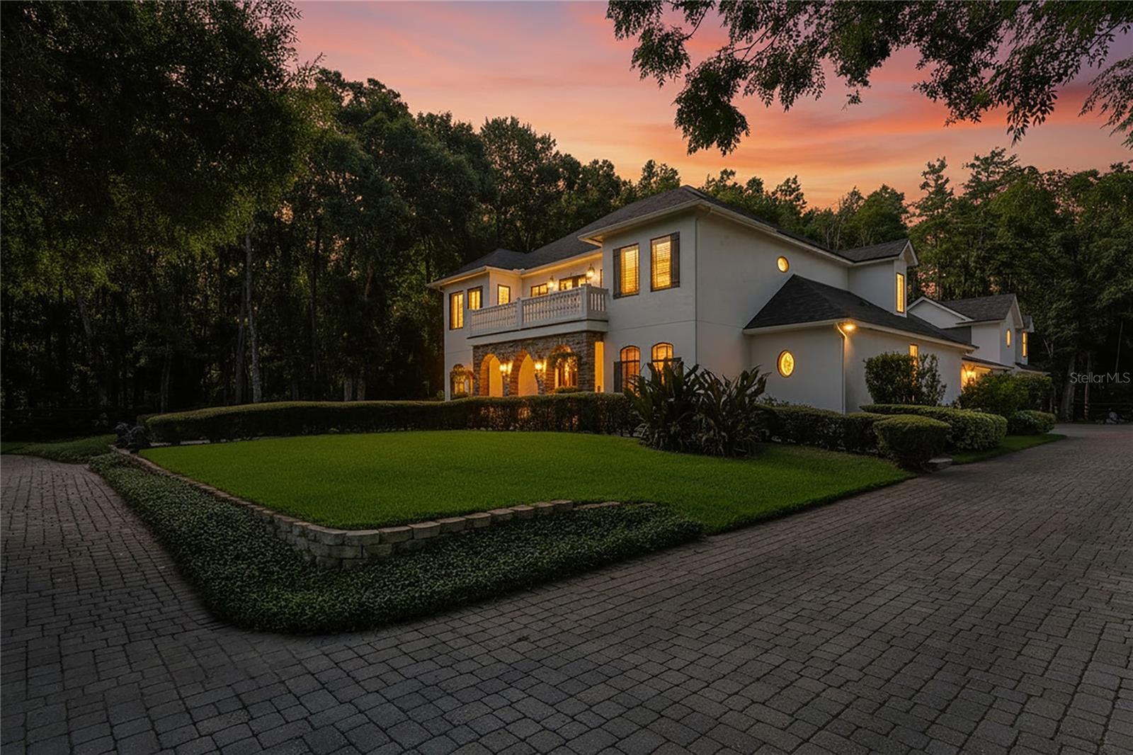 Gorgeous Southern Estate nestled on five pristine acres, agriculturally zoned in North Pinellas, this extraordinary 6,200 square-foot modern farmhouse seamlessly blends timeless elegance with modern luxury. Designed for both refined living and exceptional entertaining, the estate offers six spacious bedrooms, five-and a half bath, and an impressive collection of indoor and outdoor amenities. The thoughtfully designed floor plan feature's a private executive office, a dedicated fitness room, a large theater room and a private -in law suite, providing flexibility for multi-generational living, remote work, and recreation, Throughout the home, three custom interior fireplaces create warm and inviting gathering spaces, while expansive living areas showcase craftsmanship comfort and sophistication. Equestrian enthusiasts and hobby farmers alike will appreciate the property's impressive six-stall barn, complete with hay room and tack room all thoughtfully designed to support a variety of agricultural and equestrian pursuits. the one-of-a-kind estate presents a rare opportunity to enjoy luxury farmhouse living, equestrian amenities, and endless possibilities while maintaining convenient access to the best of North Pinellas, including local horse trails, two local beaches and three A plus schools, this home has so many features like 11–20-foot ceilings, custom cabinets, custom built ins, wood beams pella window and doors. The outside pool area is like a private resort including a 18x36 heated salt water pool with spa, tanning ledge and propane stone fireplace. This is a true one-of-a-kind home from the chef's kitchen to custom ceiling's, some furniture and decor can convey.