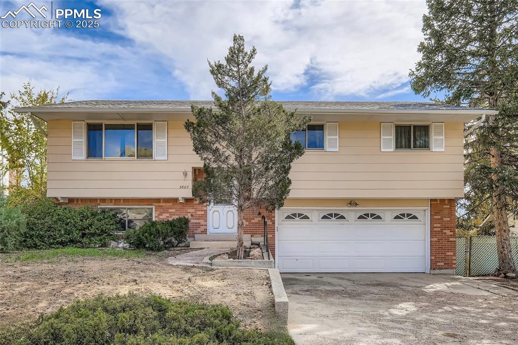 Well-cared-for home ready for your buyers! Open, light, and bright great room concept. Hardwood flooring throughout much of the main level. The kitchen features an L-shaped island with maple cabinetry, a breakfast bar, and tile flooring, all completely open to the great room and dining area. Newer smooth-top oven/range, newer built-in microwave oven, and a brand-new dishwasher. All kitchen appliances are included. Multiple ceiling fans help keep the home cool during the summer months. The large, lower-level, carpeted family room includes a closet at one end, making it possible to create a 4th bedroom if needed. The washer and dryer are included in the laundry area. Storage under the stairs, along with an oversized (23x20) 2-car garage with attached shelving, cabinets, and workbenches. Enjoy summer barbecues on the deck. An additional patio area would be perfect for a hot tub, surrounded by mature trees and shrubs, with garden areas, walkways, and space for a gazebo or firepit. Enjoy mountain views from the back of the house. Nicely appointed, flat, fully fenced backyard. Close to Valley Hi Golf Course. Hurry, this home won’t last long!