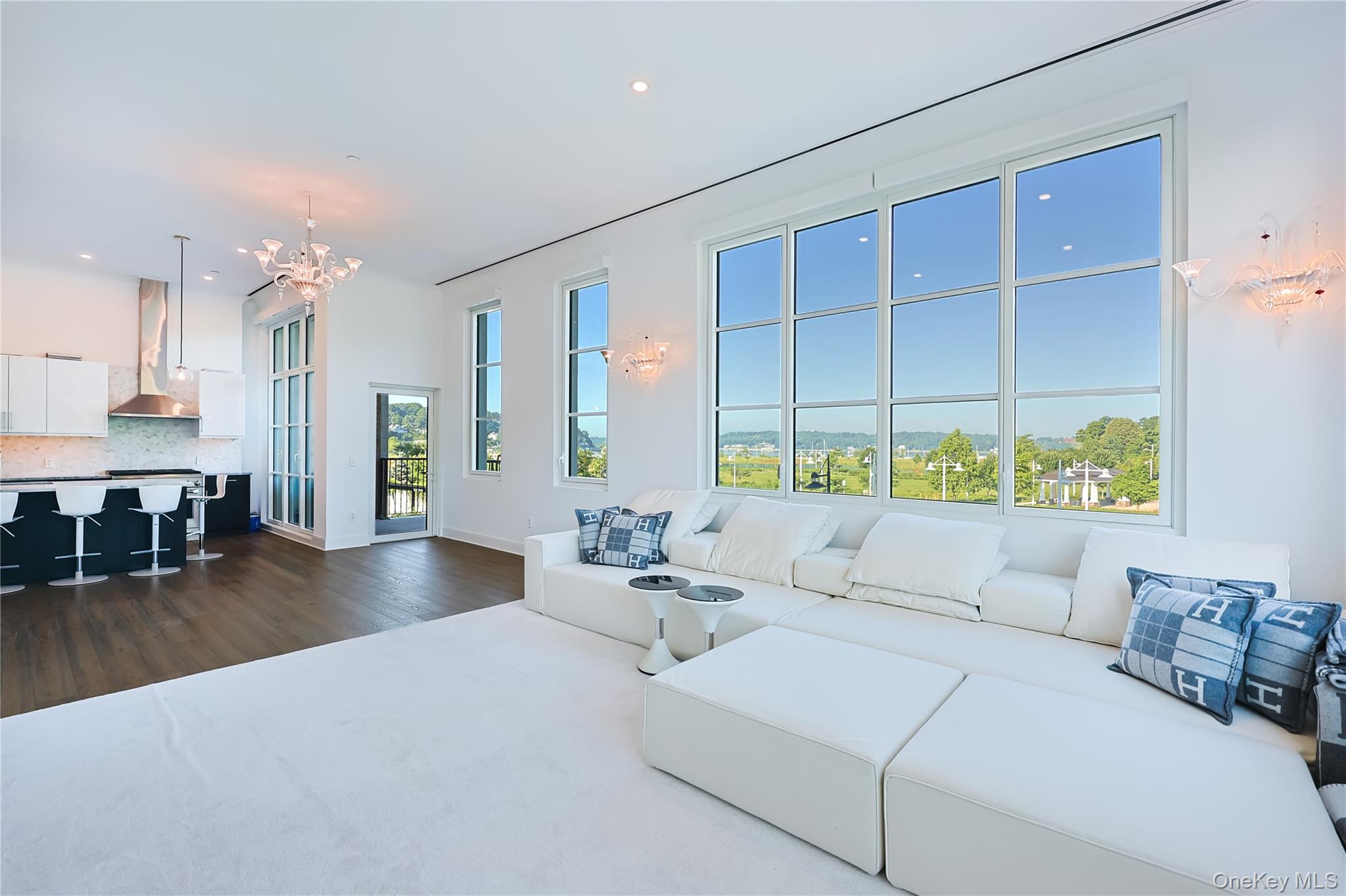 Nestled on 56 acres of pristine waterfront, Residence 1024 is an exceptional three-bedroom, three-bathroom home offering 12-foot ceilings, wall-to-wall windows, and desirable north and west exposures that fill the residence with natural light and capture stunning sunset views.Designed for elevated living and effortless entertaining, the home features a gourmet chef’s kitchen with custom-paneled GE appliances, white Brazilian quartzite countertops, an oversized island with a Kohler under-mount sink, Sharp drawer microwave, Insinkerator disposal, and a fully vented GE Monogram 6-burner gas range with dual infrared cooking.The spacious primary suite offers double closets and a luxurious five-fixture en-suite bath finished with white marble floors and countertops, full-height porcelain tiled walls, a glass-enclosed shower, double vanity, premium Kohler fixtures, heated marble floors, updated toilets, and heated towel racks for a spa-like experience.Additional highlights include an in-home stackable washer and dryer, over $100,000 in upgrades, three large private storage units, select high-end furnishings by Italian luxury brand Gamma, and elegant Baccarat crystal chandeliers that bring a refined European touch throughout.A rare waterfront residence combining dramatic scale, designer finishes, exceptional upgrades, and breathtaking views.