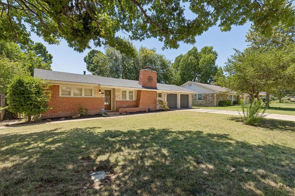 Pristine, warm, and inviting ~ Beautifully updated 3-bedroom, 2-bath home on over 1/4 Acre in one of OKC’s highly sought-after neighborhoods, Wileman Belle Isle. This home has great curb appeal with stacked stone accents, and fabulous backyard with mature landscaping and gorgeous shade trees. Inside, you’ll find wood floors and abundant natural light throughout. The spacious living room and cozy family room with fireplace provide plenty of space to relax and entertain. The family room flows easily into the dining area and updated kitchen, which features ample cabinetry, a storage pantry, stylish green tile backsplash and a coffee bar. The large primary suite offers a walk-in closet and full ensuite bath, while the secondary bedrooms are generously sized. The Pella windows have custom wood shutters in all rooms. Enjoy outdoor living on the patio overlooking the big, tree-filled backyard. Additional highlights include a laundry room with utility sink, 2023 roof, sprinkler system, and built-in garage storage. Prime location close to The Oak, Penn Square Mall, and Nichols Hills dining and shopping. New in 2026: Total Electrical Rewire with New Breaker Box; New AC Fan, Complete Interior Repaint including all Ceilings, New Light Fixtures in Bathroom & Kitchen, and New Ceiling Fans in Bedrooms; and Fireplace Brick Painted ~ Welcome Home!