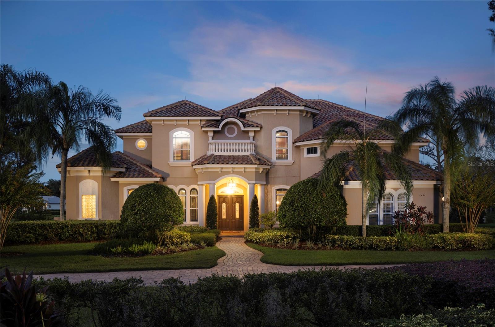 Under contract-accepting backup offers. Experience refined living in the desired, guard-gated community of Lake Markham Preserve, an exclusive community of only 59 opulent residences. Poised on nearly two private acres, this 6,000-square-foot custom estate captures timeless elegance and luxury with captivating views of beautiful Lake Markham. A grand two-story design welcomes you with 24-foot ceilings, expansive windows, and exquisite architectural details including wood flooring, crown molding and custom arches. The owner’s suite is a serene retreat with breathtaking lake views, dual walk-in closets, and a spa-inspired bath with jetted tub and walk-in shower. Designed for entertaining, the chef’s kitchen boasts gas cooking, dual sinks and a large center island, while the formal dining room features a butler’s pantry and wine closet. Upstairs, dual staircases lead to versatile lofts, a media room with wet bar, and three additional bedrooms, including one with a private balcony overlooking the pool and lake. Go outdoors to a two-story screened lanai with an oversized pool, spa and summer kitchen, creating the ultimate resort-style oasis. Lake Markham Preserve is only minutes from the best of Sanford and Lake Mary, acclaimed medical centers, boutique shopping, and top-rated golf and country clubs, with effortless access to Orlando, Winter Park, and Central Florida’s renowned attractions and beaches. This is luxury living at its finest. It's exclusive, elegant and designed for those who demand the extraordinary.