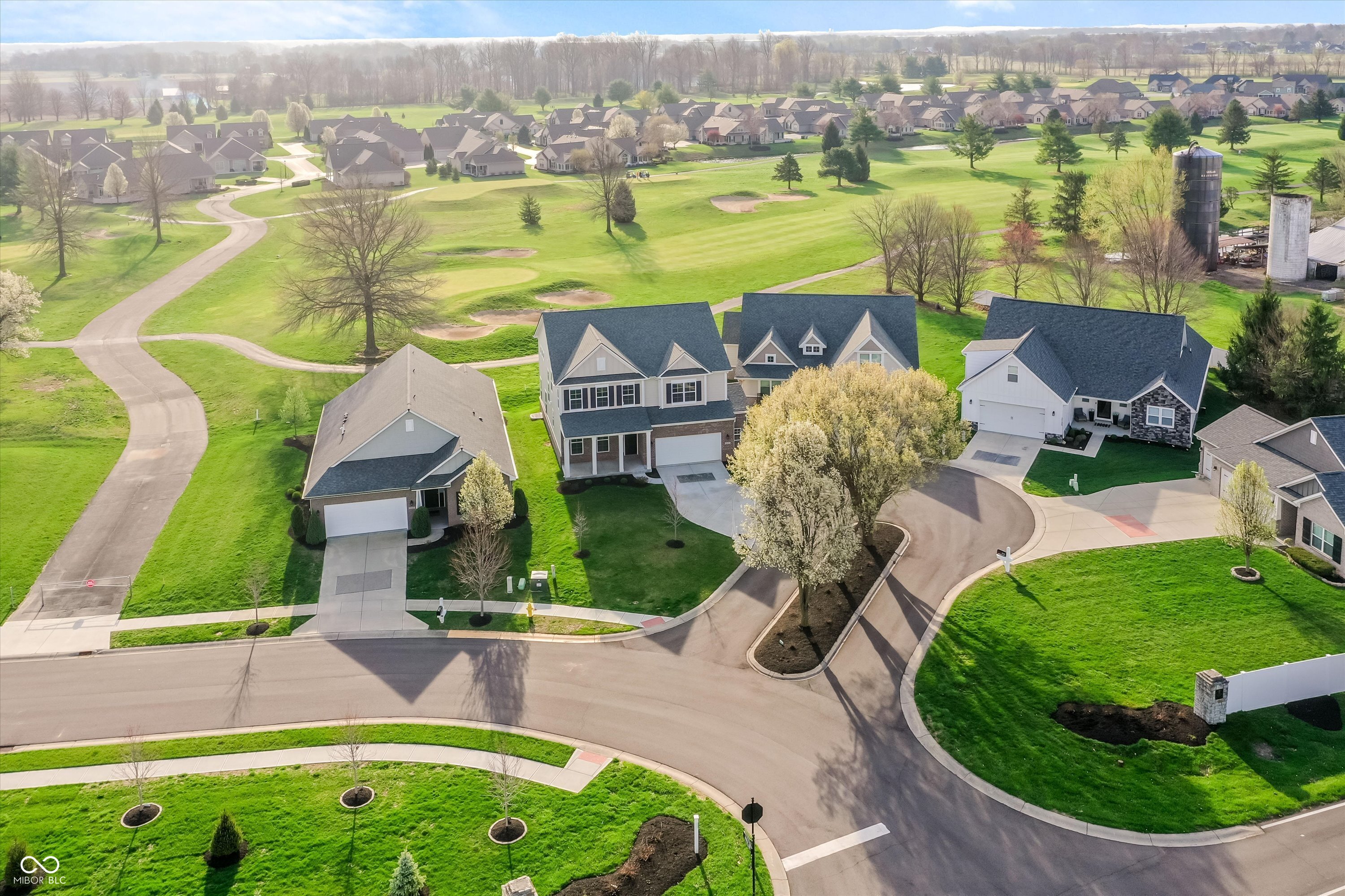 Experience Luxury & Low-Maintenance Golf Course Living. Completed in August of 2023, this 2-level residence w/a basement was impeccably finished w/ high-end finishes & backed directly onto the lush greens of The Legends of Indiana Golf Course. This home is designed for both entertaining & everyday comfort. The heart of the home, a Gourmet Kitchen & Great Room, features a stunning custom stone fireplace (a $4,690 upgrade), a SUPER-sized walk-in pantry, WIFI double convection ovens (including a built-in air fryer), and additional electrical outlets have been strategically placed throughout. Cabinetry is a neutral linen shade, w/a large black accent island & quartz countertops. Additional windows added - Rise & Shine to breathtaking sunrise views; the primary suite, sunroom, Great Room, kitchen, and covered porch all offer a front-row seat to the morning sunrise over the pristine golf course. Premium flooring Upgrades - Main Level, Sept 2025 - Brand-new LVP spans the entire level, offering modern elegance & durability. Upper Level, late 2024 - Walk on clouds w/the highest builder-grade carpet installed throughout the private quarters & loft.  The laundry room is conveniently located upstairs & features direct access to the Primary. You will love the navy cabinetry & blue/navy tile floor!  Basement Potential: The framed basement is already plumbed for a full bath & upgraded w/a 100-amp service panel - the owner's vision was bar/entertainment, workshop, & storage.  It is truly a blank canvas waiting to be finished to suit your lifestyle!  Effortless Grounds: Low-maintenance HOA covers mowing, mulching, shrub trimming, irrigation maintenance, & snow removal. Prime Location: Enjoy the best of Franklin, w/access to the scenic Franklin Greenway Trail, the vibrant shops & dining of Downtown Franklin, Festivals, Amphitheater, Parks, Aquatic Center, Hillview Country Club, Groceries, Superstores, Medical Facilities, Hospital, & nearby I-65 makes for easy commutes