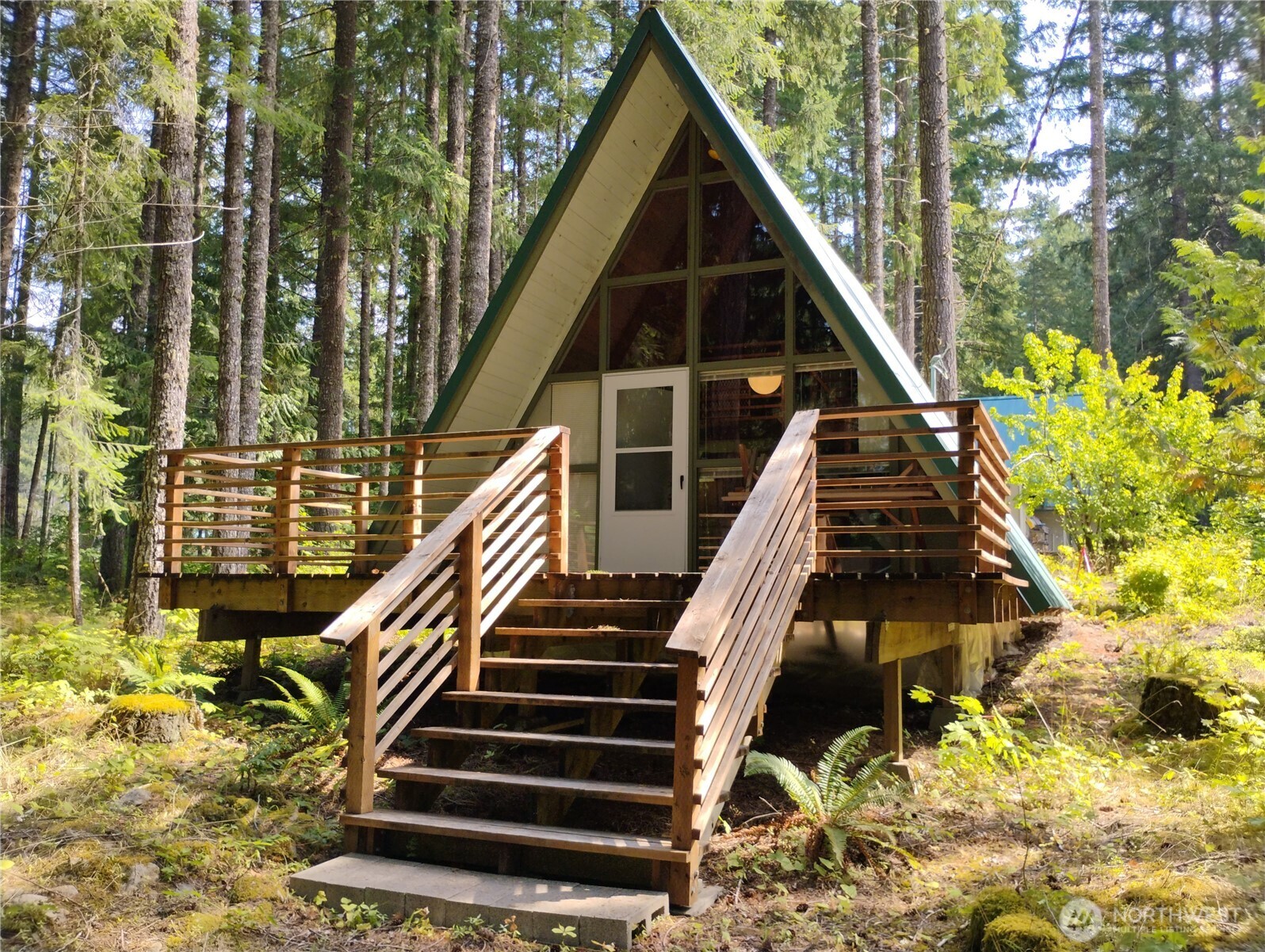 Surrounded by Forest! This .17-acre lot is in desirable Lower Timberline Village with an A-Frame that offers classic cedar interior for timeless charm. The open living area and kitchen with eating area create a cozy gathering space, while the loft provides sleeping room. Enjoy an updated bathroom with shower. Metal roof. Also a storage shed. Community amenities include outdoor swimming pools, playground, open field, tennis court, and clubhouse. Conveniently close to Santa Milagro Restaurant, with White Pass Ski Area less than 20 miles away. Hiking, biking, and fishing are right at your doorstep—perfect for year-round adventure! Buyer Bonus of $5,000.00 at closing offered by seller.