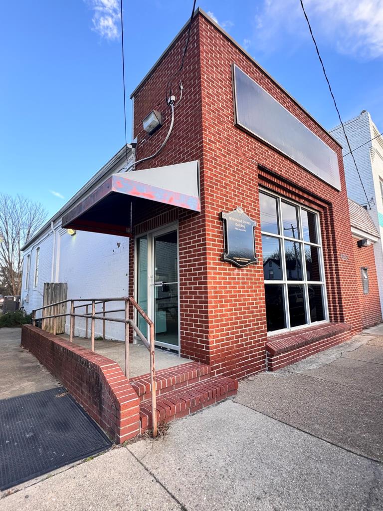 Historic Commercial Building with Iconic Bank Vault | Rt. 13 Visibility 10233 Rogers Drive, Nassawadox, VA. Rare opportunity to own a former bank building with exceptional character and high visibility along Route 13, the Eastern Shore's primary north/south corridor. Originally the Bank of Northampton County (est. 1906, rebuilt 1919), this property blends preserved architectural details with functional updates. Main entry opens to a spacious, light-filled open room with tile floors. Features include a renovated bath with tile and chandelier, flex room for meetings or break area, and the centerpiece original steel bank vault with intact safety deposit boxes. Right wing offers open reception space and two private offices. Ideal for professional office, medical, retail, creative, or specialty
