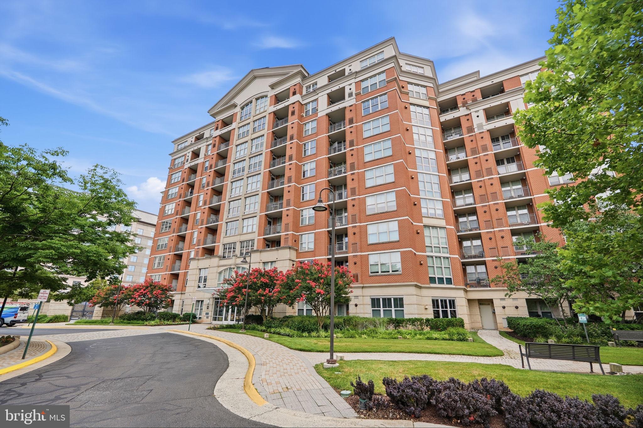 Experience elevated living at The Mercer in Reston! This stunning 2-bedroom, 2-bath corner residence is ideally situated on the 8th floor, offering breathtaking panoramic views stretching all the way to Tysons Corner and spectacular sunrises visible from every room. Abundant natural light fills the home, creating a bright and sophisticated atmosphere throughout.The main living area features beautiful solid French oak hardwood flooring, while distinctive Olive Barcelona cork flooring extends throughout the remainder of the condo, adding warmth, style, and character. Thoughtfully designed for both comfort and convenience, the home also features stainless steel appliances and custom closets. The HVAC system, water heater, and full-sized washer and dryer were all replaced in 2019.The Mercer offers an exceptional lifestyle with concierge service, on-site management, an outdoor swimming pool, fitness center, billiards/club room, and business/conference center. Residents also enjoy access to Reston’s extensive array of recreational amenities through the HOA.Ideally located just minutes from major commuter routes, bus service, Metro, shopping, dining, and all that Reston has to offer, with Dulles International Airport approximately 10 minutes away. From its luxurious finishes and panoramic views to its exceptional location and outstanding amenities, this beautiful corner residence offers the perfect combination of contemporary elegance, comfort, and convenience.  ALL FURNITURE IN THE CONDO IS AVAILABLE FOR PURCHASE.