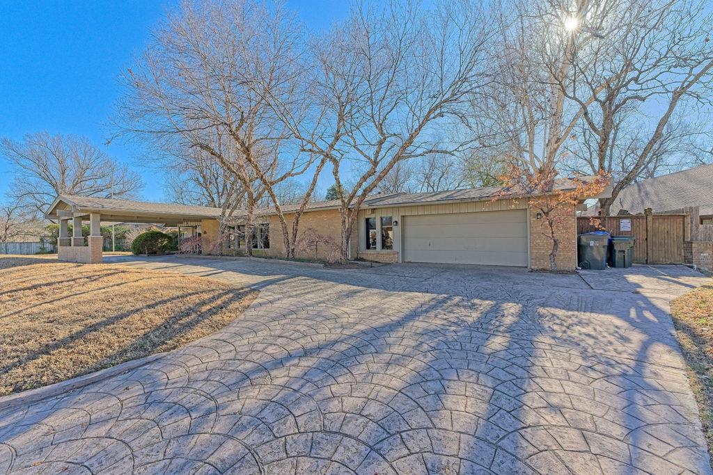 This is the chance to own a very unique beautiful home near the University of Oklahoma.  Featuring 3752 ft.² of amazing interior living space with an additional huge outdoor living space overlooking an incredible 13 foot deep in-ground swimming pool, which includes a diving board.The main living area has tall ceilings, tons of natural light, and a beautiful hearth.  The terrazzo flooring is timeless. The second living space, perfect for pool entertainment, features a kitchenette, half bath, and french-doors opening to the pool/patio.The third living space is a tremendous sunroom, which over looks the incredible backyard. It also connects the home office to the primary bedroom.The kitchen features lots of cabinets, stainless appliances, and amazing granite counters.The breakfast nook overlooks the front of the home and the formal dining is in the main entertaining area.The primary is set up for handicap needs while all the bedrooms are very spacious.The backyard features the pool, fire pit, large rock patio with pond and waterfall, walking paths and the property backs to a creek. It is truly and outdoor lovers dream.This is one of Norman's most unique homes!