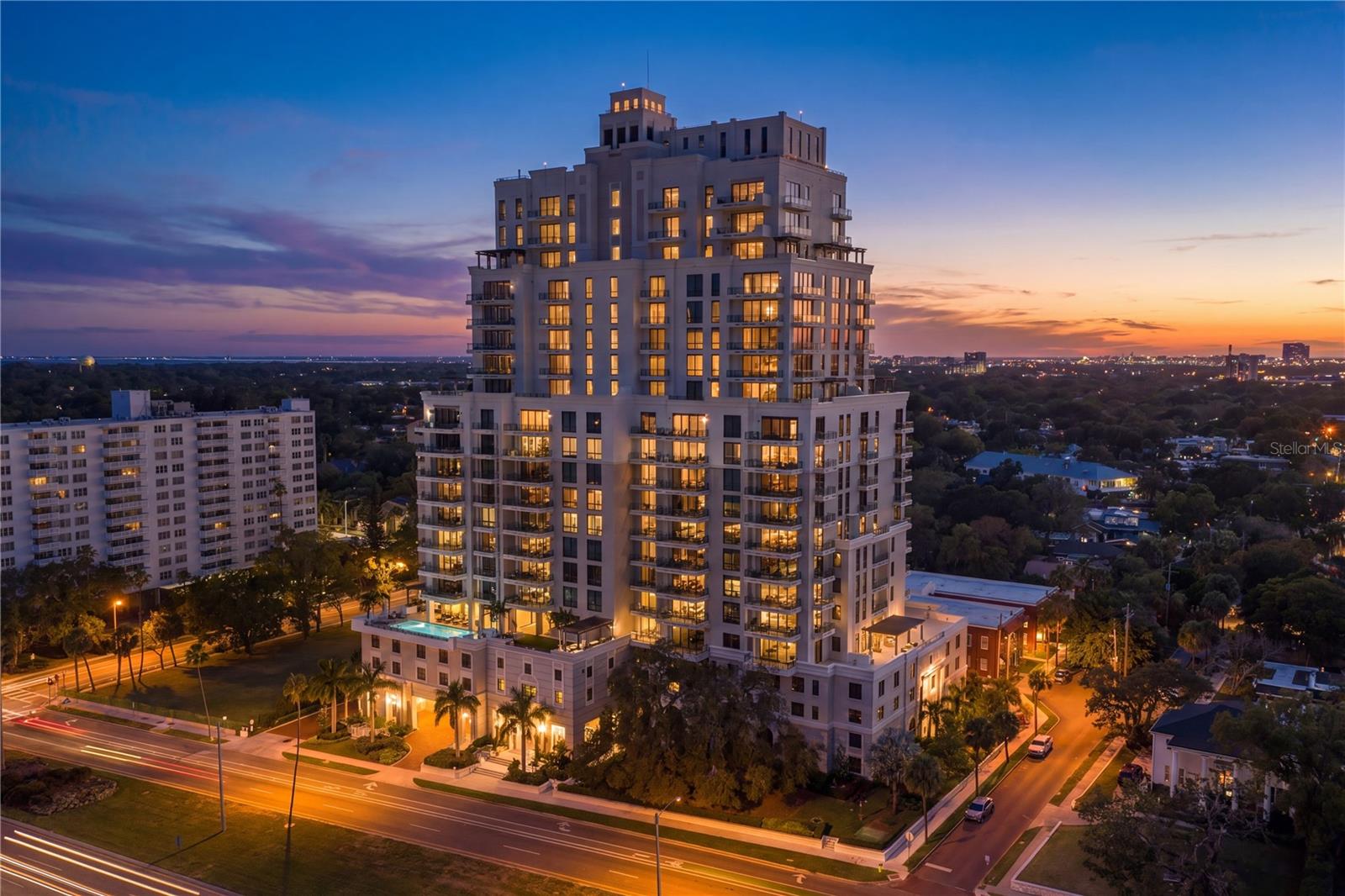 In South Tampa's Most Desirable & Sought After Location on Bayshore - Hyde Park House! For those who value a truly walkable urban lifestyle, this is a chance to reside in the prestigious Hyde Park Historic District, an architecturally refined waterfront high-rise set along iconic Bayshore Boulevard.  Walkable to Hyde Park Village's exclusive restaurants and shops as well as South Howard Ave's famous SoHo District featuring locally renown eateries and boutiques. This is truly the most desirable building for those who value location! Enjoy breathtaking sunrise & sunset skies from two oversized balconies overlooking the bay and Tampa's skyline.Inside, a sophisticated open-concept layout is enhanced by soaring 10-foot ceilings, large-format porcelain tile flooring, designer lighting, custom closet built-in's and remote-operated shades throughout. The chef’s kitchen is a statement in both form and function, appointed with sleek European-style cabinetry, quartz countertops, and Gaggenau appliances—perfectly suited for both entertaining and everyday indulgence.  The kitchen was upgraded during construction for wiring to accommodate the induction cooktop. It also has the gas valve for those who desire this option.The owner’s suite serves as a serene retreat, complete with walk-in closet fully customized and built-out and a spa-inspired bath featuring dual vanities, a frameless glass shower with rain head and body sprays, and elevated finishes throughout. Thoughtfully designed closets are found in every room, and a rare spacious laundry room with abundant storage further enhance the effortless livability.Residents of Hyde Park House enjoy an unparalleled collection of private, resort-style amenities. The amenity floor features a stunning infinity-edge heated pool overlooking the bay, complemented by a spa, gas fire pits, and an outdoor summer kitchen with premium entertaining features including gas grill, pellet ice machine, and additional refrigeration. Indoors, a beautifully appointed social lounge offers gathering spaces, a gas fireplace, and media areas, while a state-of-the-art fitness center includes dedicated studios for spin, yoga, and personal training.  The condo maintenance fees also include hot water, cooling tower for HVAC, cable/internet, water/sewer/trash, gas, insurance, maintenance and building reserves.  Additional features include two parking spaces on level 4 of the garage (which happen to be the most prime, private and oversized in the building with wall on either side not adjacent to another space), controlled-access garage entry, 24/7 concierge service in the lobby, daily building staff, a climate-controlled storage unit, bicycle storage, and a dedicated pet washing station—ensuring every aspect of convenience and comfort is thoughtfully addressed. This is more than a residence—it is a statement of elevated living in one of Tampa’s most coveted addresses. Refined, rare, and impeccably appointed, this offering invites you to experience luxury living at its finest.  Schedule your private showing today!