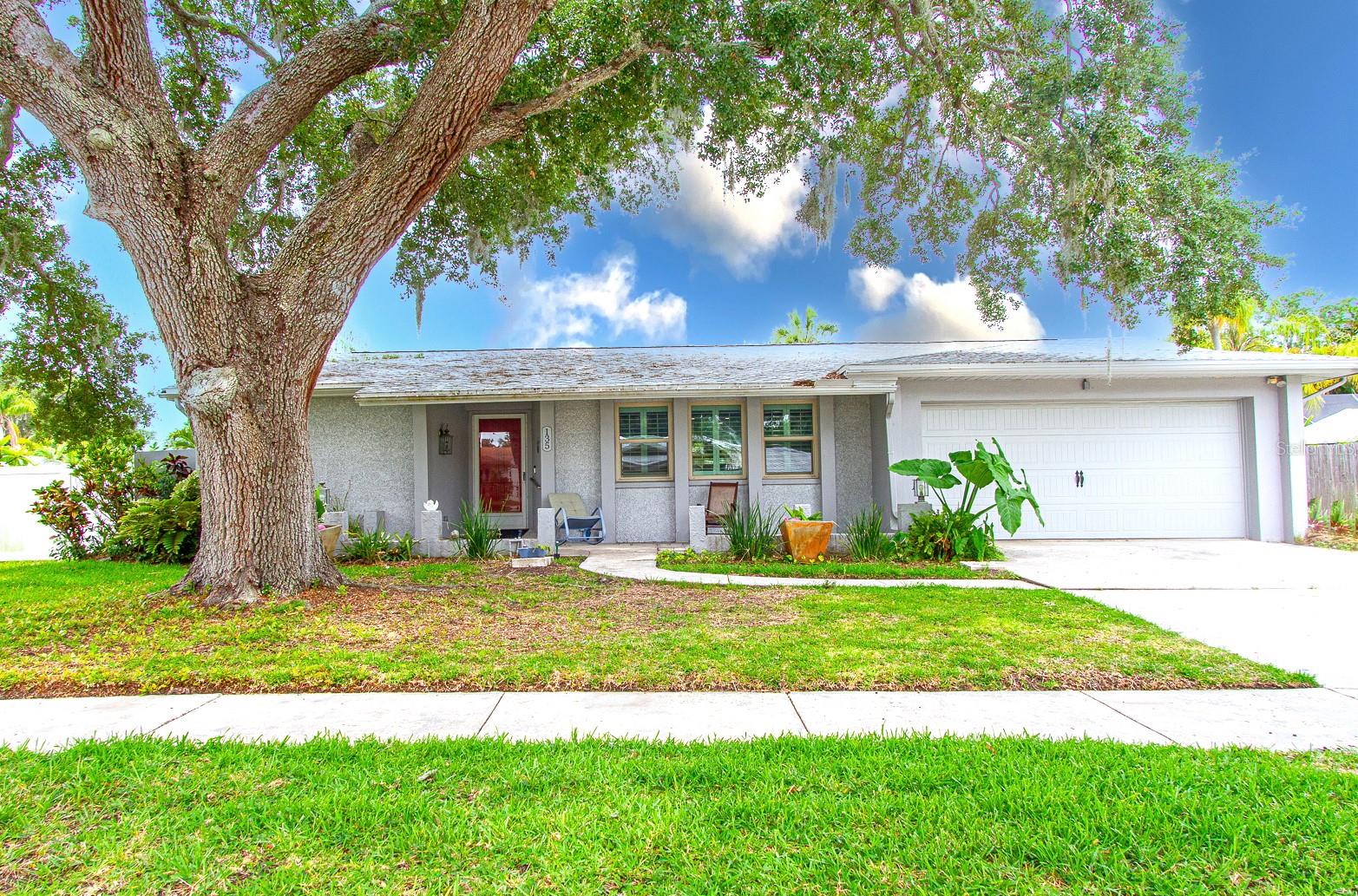 Completely renovated pool home located in the Palm Harbor University School District, sitting in a non-flood zone location. Major updates include the following: 2020 Pool Build by Landmark Pools with a pebble sheen pool finish, sun shelf seat, and waterfall system with adjustable back jets, plus pool heater. Hayward Lighting effects and added Lamanaar Deck Jets for additional pool effects. 2020 Home remodeled with new hurricane windows and doors. 2019 New garage door and motor installed. 2020 New pool screen. 2022 Solar Pannels installed then removed and reinstalled in 2025 when new roof installed. 2025 Entire main and flat roof replaced. 2019 Hot water heater replaced with new htr elements replaced May 2026. 2020 Kitchen remodeled with granite countertops, convection oven, range top, custom exhaust fan, under-counter microwave, dishwasher, garbage disposal, double-door stainless refrigerator, and upgraded lighting effects to enhance your dining experience with USB outlets to charge your lap top or phone. Additionally, both bathrooms remodeled. Plus Brazilian Cherry flooring throughout the living room and bedroom areas. New owner to assume solar panel lease (approx $22,000.) Solar panel payment around $125.00 each month and Duke Energy payment around $30.00 each month (Duke Energy bill in attachments). SOLD "AS IS" See less