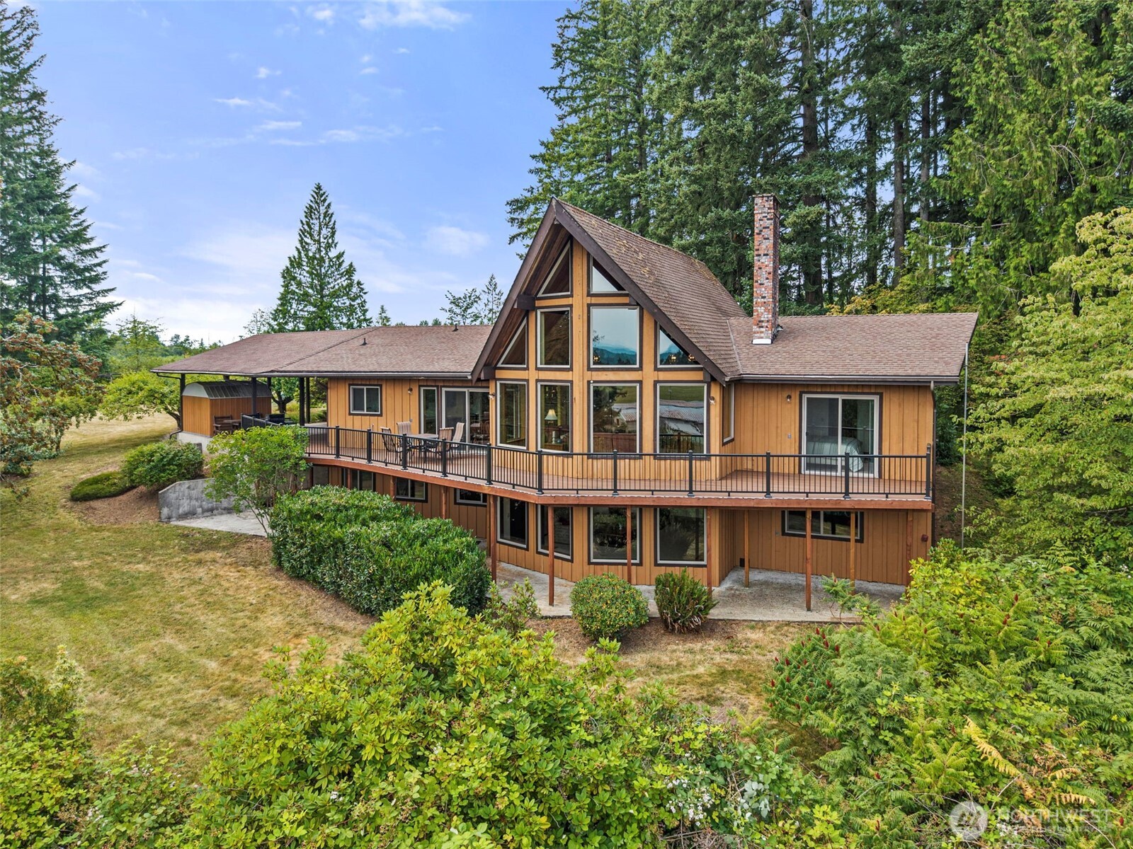 A once in a generation opportunity to own an extraordinary legacy estate where refined country living meets breathtaking natural beauty. Set behind a gated entrance on 18 remarkable acres, this impeccably maintained 4,000+ square-foot custom residence commands sweeping views of Mount St. Helens, the Cowlitz River valley, and the ever-changing Pacific Northwest landscape from its expansive deck and sun-filled living spaces. Lovingly cared for by a single family throughout its history, the home blends timeless craftsmanship with thoughtful updates, including new windows, a new furnace, and a heat pump. Designed for both elegant entertaining and everyday comfort, it features grand gathering spaces, fireplaces in both the living and family rooms, a wet bar, custom built-in dining cabinetry, and a small wine cellar ready for your finest collection. Outside, the estate unfolds into an exceptional blend of natural beauty. Stroll through park-like grounds, harvest from the established orchard, cultivate the garden, or explore acres of whimsical forest and mature landscapes. Whether your passion is hiking, horseback riding, ATV adventures, wildlife watching, or simply savoring the peace and privacy, this property offers an unmatched outdoor lifestyle. Just 2.5 miles from salmon & steelhead fishing. Also listed MLS# 2558939, additional acreage.
