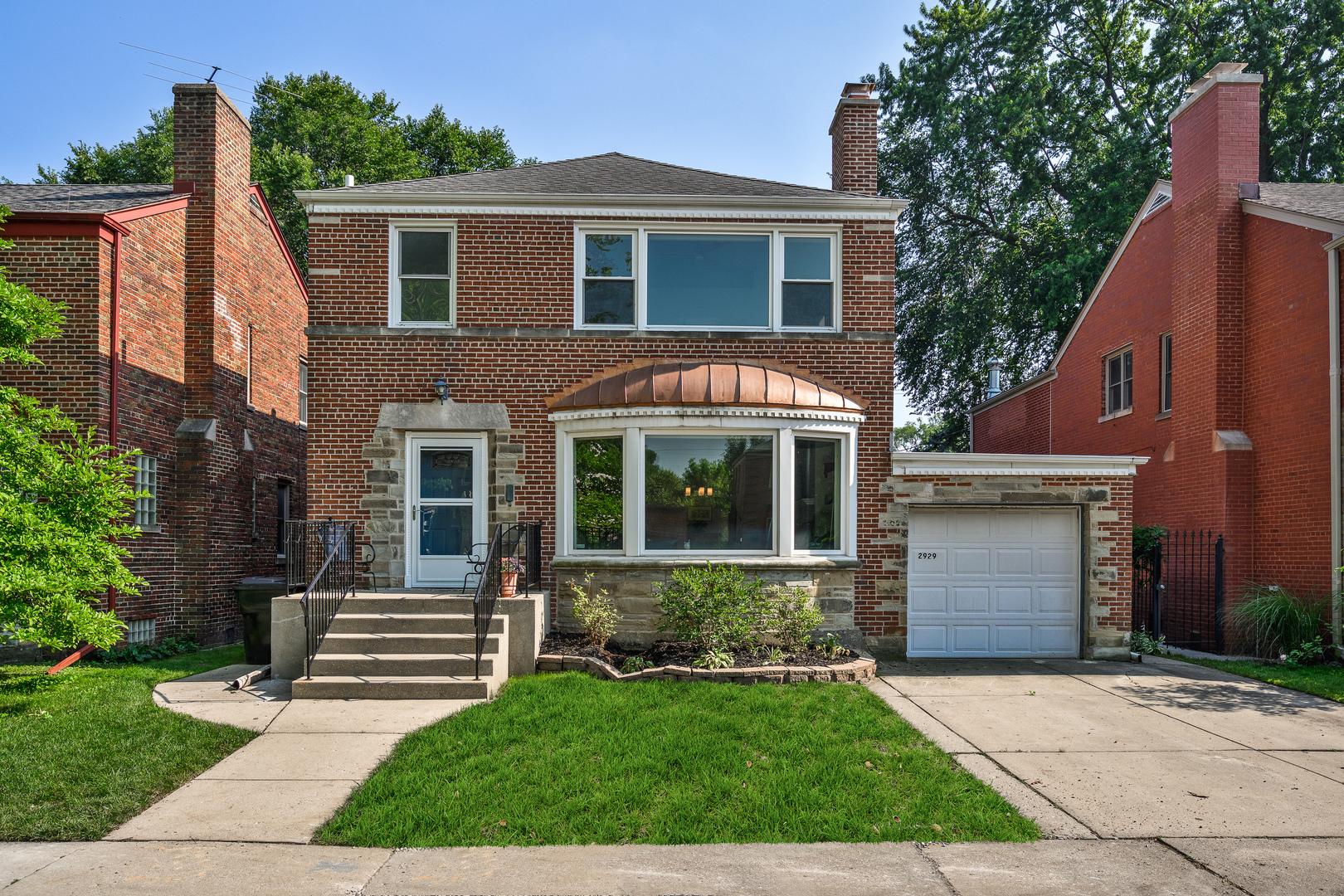 Welcome to sought after Budlong Woods, on one of the premier blocks! This gorgeous Jumbo Georgian, which features four bedrooms (3 up, 1 down) and 3 1/2 baths, sits on an extra-wide lot.  Enter the large living room with custom built-ins that frame the fireplace.  This spacious and meticulously maintained home offers a perfect blend of vintage character with modern upgrades. The kitchen features a newer cabinet with custom butcher block that creates an eat-in peninsula. Enter the separate Dining Room and quaint sunroom from the kitchen. Primary suite includes added vaulted ceilings, an expanded primary walk-in closet, and a luxurious ensuite bathroom with radiant floor heating, double sinks, and a separate tub. The basement was renovated in 2019 and includes a finished living space with vinyl flooring, laundry room with washer/dryer, and ample storage space. Enjoy the large fenced in amazing backyard with an expansive deck, and multiple outdoor seating areas for year-round entertaining. Newer sewer line from street to home has just been put in. Located in a vibrant neighborhood with easy access to Legion Park's expansive trails along the Chicago River (Bicycler's Paradise), Budlong Woods Library, and the Galter Life Center.  Enjoy the close proximity to River Park's swimming pool/splash pad, the Nature Center on Western Avenue, and bustling Lincoln Square, known for its lively restaurants and festivals. Don't miss this opportunity to own a beautiful home in a prime location!