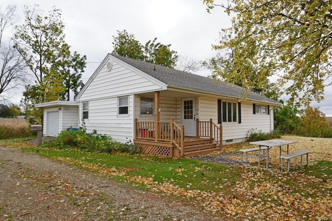 Just the right size! This 2-bedroom home offers a comfortable layout with 2 bedrooms and a full hall bath. The spacious living room features picture windows and a dining area. The kitchen has an efficient layout and an informal dining area. Down the hall are two bedrooms and a full hall bath. Laundry hookups are available in one of the bedrooms, as well as in the basement. A breezeway connects the home to the attached one-car garage, providing convenient access in all seasons. The full basement has excellent potential for additional living space, hobbies, and storage, with a rough-in 3/4 bath already in place. Situated on a nice 0.2-acre corner lot, this property offers a great opportunity to make it your own!