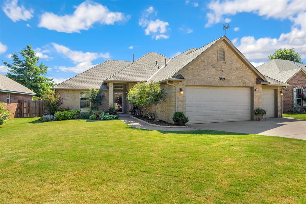 Beautiful one owner home located on a greenbelt lot in the desirable community of Stonebrook @ Coffee Creek.  Ideal & inviting offering a split floorplan with three bedrooms plus study.  From flooring to the trim package to exterior being completely bricked, this meticulously maintained property parades appealing features along with upgrades. Quartz countertops in kitchen with double under mount sink, black stainless appliances, & rich cabinetry;  along with the sizeable breakfast room plus bar area, this kitchen's designed for hosting.  The wall of, newer, picturesque windows in the breakfast area plus living, is inviting & peaceful w/plentiful natural light.  Where comfort meets tranquility, this living area is open & airy, adorned with a handsome brick fireplace/hearth trimmed with attractive wood.  The guest wing offers two bedrooms & hall bath; study is adjacent to foyer.  Sizeable primary is private (no direct sight from living area); double vanity w/under mount sinks & new stone.   The homeowners have so many improvements during ownership!  New windows with Plantation shutters throughout, insulated garage doors, storm shelter, roof, HVAC, Hot Water Tank, landscaping, flooring ( LVP, carpet+padding), countertops & paint.  Amenities offered as a resident of Coffee Creek include multiple pools, tennis courts, basketball courts, walking trails, ponds & recreational centers; the elementary, middle and high schools all within a mile as well as Mitch Park, YMCA, grocery, dining, medical.