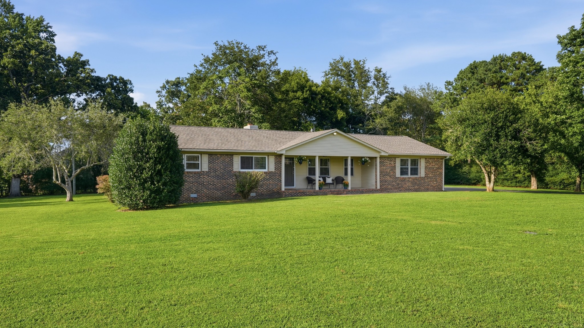 Welcome to this well-maintained 3 bedroom, 2 bath brick home situated on 1.3 acre lot in a quiet well-established neighborhood just minutes from the lake. This charming property offers the perfect balance of privacy space and convenience, making it ideal for families, downsizing, or anyone looking to enjoy peaceful living close to outdoor recreation. The home features a bright and inviting living room, a well-appointed kitchen with plenty of counter and cabinet space, and a dining area perfect for everyday meals and entertaining. The primary bedroom includes a private full bath, while two additional bedrooms provide flexibility for guests, family members, or a home office. Step outside to enjoy the screened in back porch, providing the perfect space to relax, entertain, or enjoy the outdoors while staying protected from the elements. The expansive 1.3-acre lot offers plenty of room for outdoor activities, gardening, or simply enjoying the peaceful surroundings. The classic brick exterior adds timeless curb appeal and durability or low-maintenance living.
