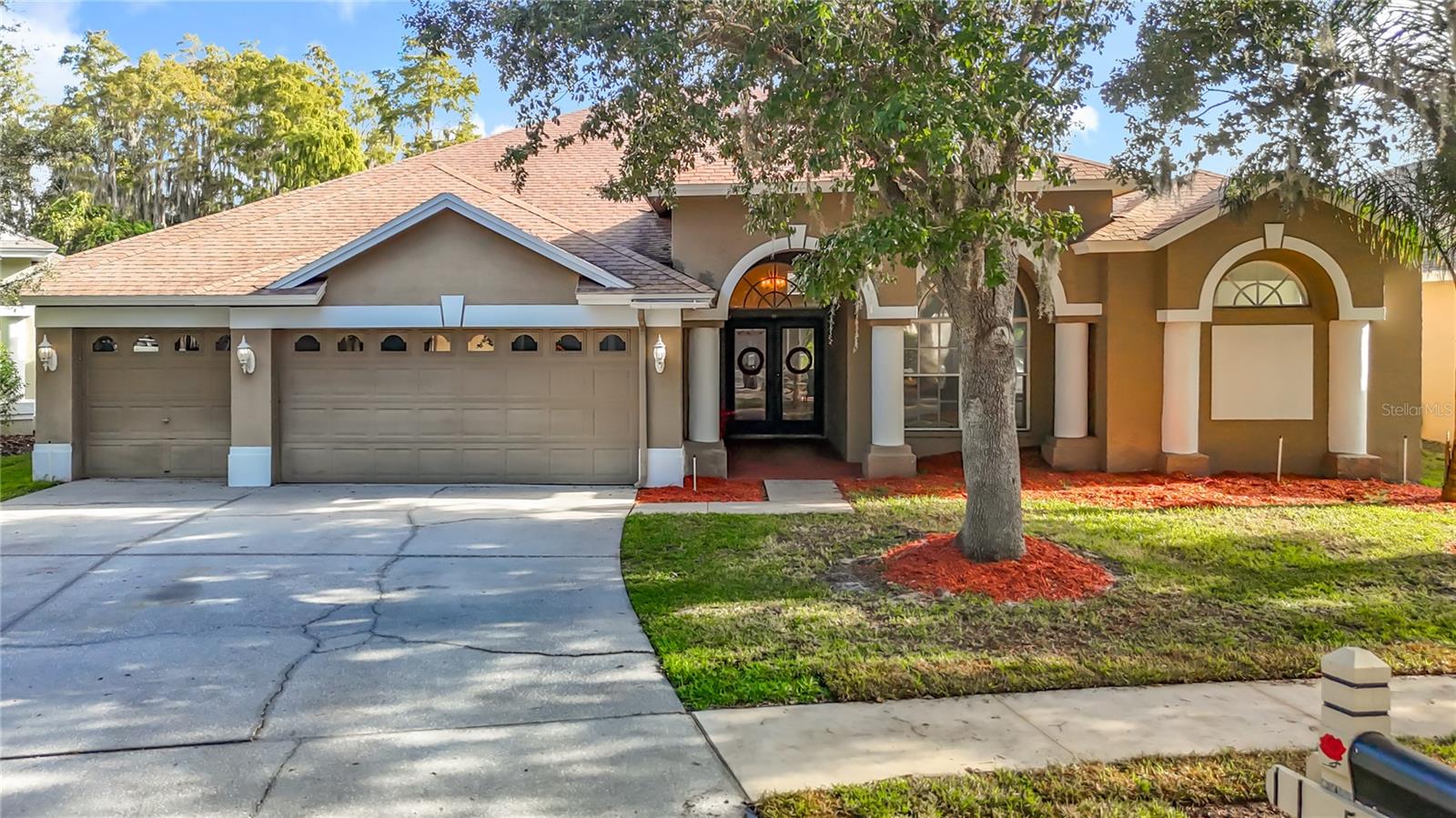 Discover the potential of this beautiful 4/3 pool home in the highly sought after Villa Rosa community! Set on a peaceful pond lot, this property offers tranquil views and a spacious layout that’s ready for your personal touch. Inside, you’ll find an open split-bedroom floorplan with high ceilings, a gas fireplace, and built-in entertainment center. The formal dining room is perfect for hosting, while the kitchen overlooks the living area and pool, ideal for family gatherings or entertaining friends. The master suite features dual closets, dual vanities, a soaking tub, walk-in shower, and lovely views of the pool and pond. The 4th bedroom serves perfectly as a guest or in-law suite with its own bath and pool access. Step outside to the covered lanai and screened in pool with spa, complimented by relaxing pond views. While some finishes are original and ready for updates, this home has incredible bones and offers a wonderful opportunity to create your dream space in one of Lutz’s most desirable neighborhoods. Additional features include a 3 car garage, low HOA, and no CDD fees. Zoned for top-rated schools: McKitrick Elementary, Martinez Middle, and Steinbrenner High. Just minutes to the Veterans/Suncoast Parkway for an easy Tampa Bay commute. With a little TLC, this Villa Rosa gem could truly shine!