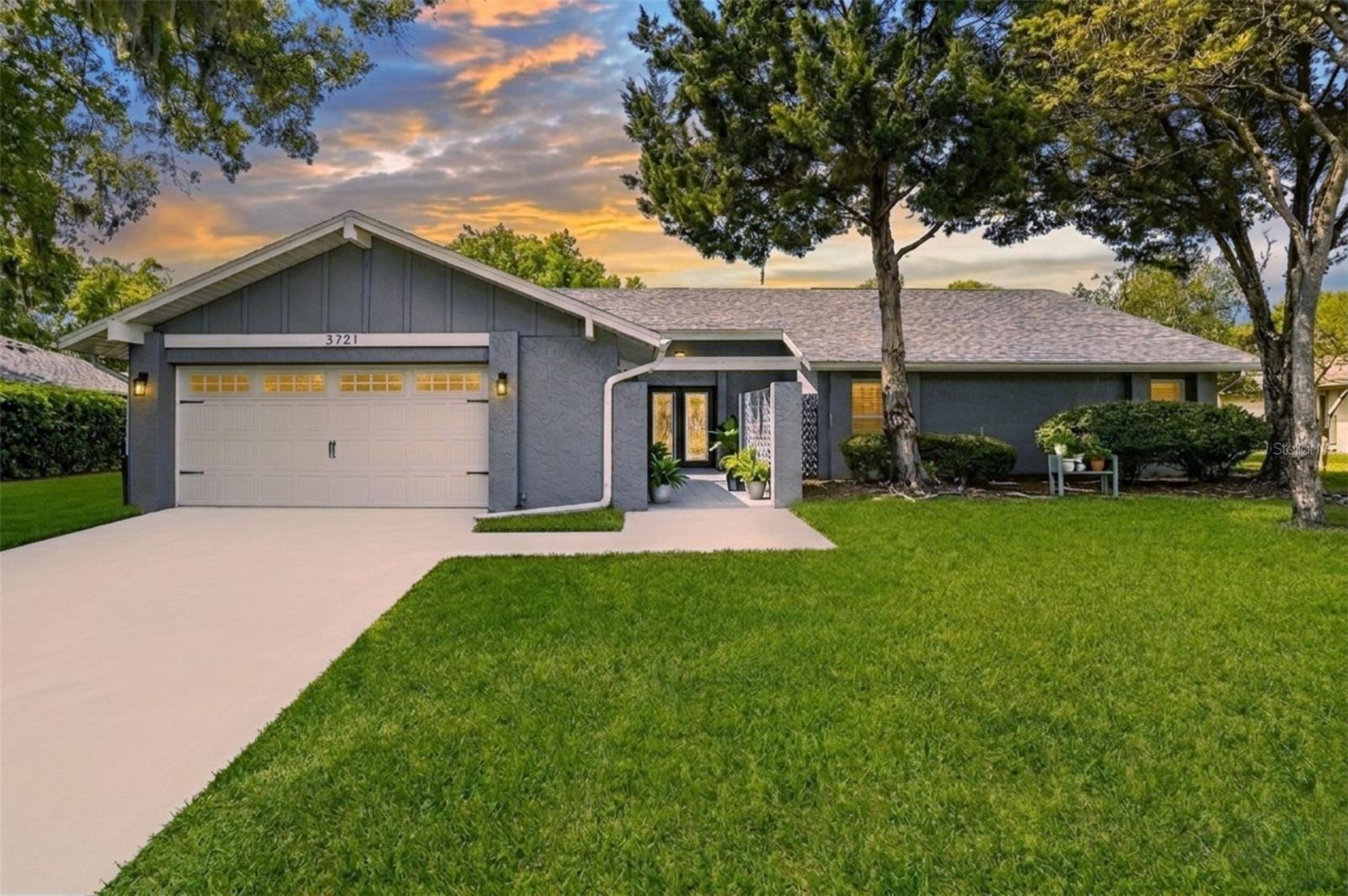 Welcome to your private retreat in the heart of Carrollwood! Located at 3721 Monarch Drive in Tampa (33618), this beautifully updated 4-bedroom, 2.5-bath pool home offers over 2500 sq ft of versatile living space in one of North Tampa’s most established communities.Step through the impressive double-door entry with leaded glass into a home designed for both everyday comfort and effortless entertaining. The family room overlooks the updated light kitchen, featuring granite countertops, a large island with modern pendant lighting, gas range, and stainless steel appliances. A matching, built-in bar and wood-burning, stone fireplace add warmth and character to the main living space.The layout offers multiple living areas, including a formal dining room and a sunken living room with vaulted ceilings, ceiling fans, and French doors leading to the standout feature of the home…A huge air-conditioned sunroom spanning the entire back of the home, complete with brand new waterproof laminate flooring, a vintage fireplace, and walls of windows overlooking the pool—creating a seamless indoor-outdoor lifestyle buyers are actively searching for.Step outside to your fenced backyard oasis, featuring an in-ground pool with a spacious concrete patio area, perfect for relaxing, entertaining, and enjoying Florida living year-round.The primary suite offers privacy and flexibility, with French door access to an adjacent 4th bedroom—ideal as a nursery, home office, or private retreat depending on your needs. The en-suite bath includes dual vessel sinks, a walk-in shower, and an oversized closet with built-in organization system.Additional highlights include:* New Roof 2025* Freshly painted secondary bedrooms with brand new carpeting* Updated full guest bath + convenient half bath* Indoor laundry room with washer & dryer included* 2-car garage* CAT6 wiring throughout (perfect for remote work, streaming, and smart home setups)* Public water/sewer + private well (ideal for irrigation savings)* Mature landscaping and shaded lot* Hurricane Shutters 2025* Enormous Air Conditioned Sunroom.Located in a deed-restricted community with low annual fees ($195/year), this home is just minutes from Carrollwood shopping, dining, schools, and the Carrollwood Cultural Center, with easy access to Downtown Tampa, Tampa International Airport, and USF (approx. 20–30 minutes).If you’ve been searching for a move-in ready Carrollwood pool home with flexible living space, modern updates, and strong indoor-outdoor flow, this is the one.