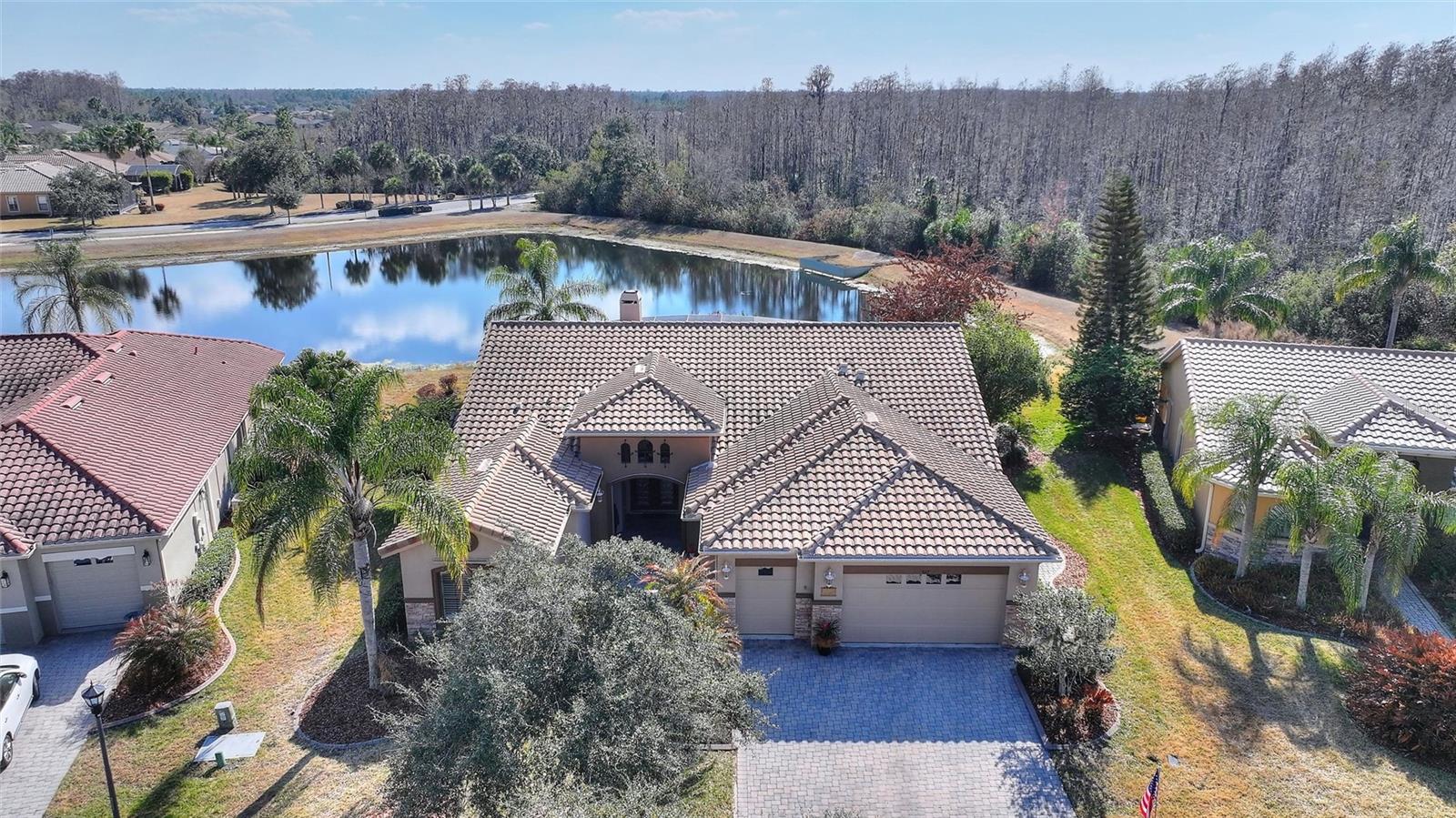 Welcome to your new Solivita home, a 3,088 Square Foot Riviera Model that is part of the Coral Gables Estates Collection. This 3 Bedroom, 3 1/2 Bath home is nestled in the desirable PORTOFINO neighborhood known for it's estate homes and large lots.  As you approach the entrance you enter through the gate into a LARGE COURTYARD and immediately notice the FRENCH DOOR entry with IMPRESSIVE LEADED GLASS DOORS.  Upon entering the home you pleased to see a large Great Room with adjoining Kitchen and Dining Room, an OPEN FLOOR PLAN ideal for entertaining. You will also notice the timeless PREMIUM TEXTURED PORCELAIN TILE, with its neutral color and durability, running throughout the living area of the home.  Turning to your left you will see a floor to ceiling CUSTOM WOOD ENTERTAINMENT CENTER with bookshelves and WOOD BURNING FIREPLACE. You will no longer need fireplace videos during the holidays since you will now have the real thing! Outside the double set of sliders you will notice the Large Lanai with an attractive SPOOL, FEATURING A WATERFALL. Perfect for relaxing and cooling off while also enjoying the lower cost of a smaller pool. As you turn toward the right you find a large, Highly Functional Kitchen that is ideal for the chef in the family and for impromptu gatherings of your guests.  BRAND NEW FRIGIDAIRE GALLERY DOUBLE WALL OVENS are ideal for preparing and timing large meals. The PANORAMIC CORNER WINDOW at the sink make will  you feel like you are part of the outside scenery. The Large Center Island is ideal for breakfast or a quick snack, as well as an ideal place for serving food at social get togethers. The dining room is spectacular with a triple tray ceiling and modern lighting. The roomy Owner's Suite features french doors, a tray ceiling and an En Suite Bathroom. The very large bathroom has Dual Vanities/Sinks, a makeup area and features a Large Glass Block Shower that turns showering into an experience. At the other end of the bathroom you enter the Retreat Room which is a very private space. It is equipped with Dual Single Murphy Beds, ideal for the the younger visitors. This home has lots of UPGRADES: a 4' retreat extension, the entry courtyard, rounded corners, tray ceilings, DOUBLE CROWN MOULDING, CENTRAL VACUUM, Premium Porcelain Tile, Wood Fireplace, Built in Entertainment Center/Bookshelves, Leaded Glass Entry Doors, Hurricane Shutters and more.  The HVAC was REPLACED in 2019, The Spool Heater in 2026, The Double Ovens in 2025. The Dryer is 2 years old. FURNISHINGS ARE INCLUDED! Arrange YOUR PRIVATE SHOWING of this outstanding home within Solivita’s dynamic 55+ community today! *PLEASE SEE THE MATTERPORT 3D VIRTUAL TOUR* With amenities such as 14 pools, 2 championship 18-hole golf courses, tennis, pickle-ball, basketball, softball, and over 240 clubs, plus spa services and two state-of-the-art exercise facilities spread across 4,200 acres of conservation, you'll have everything you need at your fingertips. Enjoy additional perks such as landscaping, irrigation, high-speed fiber internet, and TV included in the HOA. For your convenience, HCA Florida Poinciana Hospital is directly across the street along with a 42,000 square-foot medical office building. Also recently opened across the street is a new 215,000 square foot shopping Plaza featuring a Sprouts Farmers Market, multiple shopping options, and several restaurants. Please do not hesitate to come see this gorgeous home and perhaps make it YOUR new Solivita home!