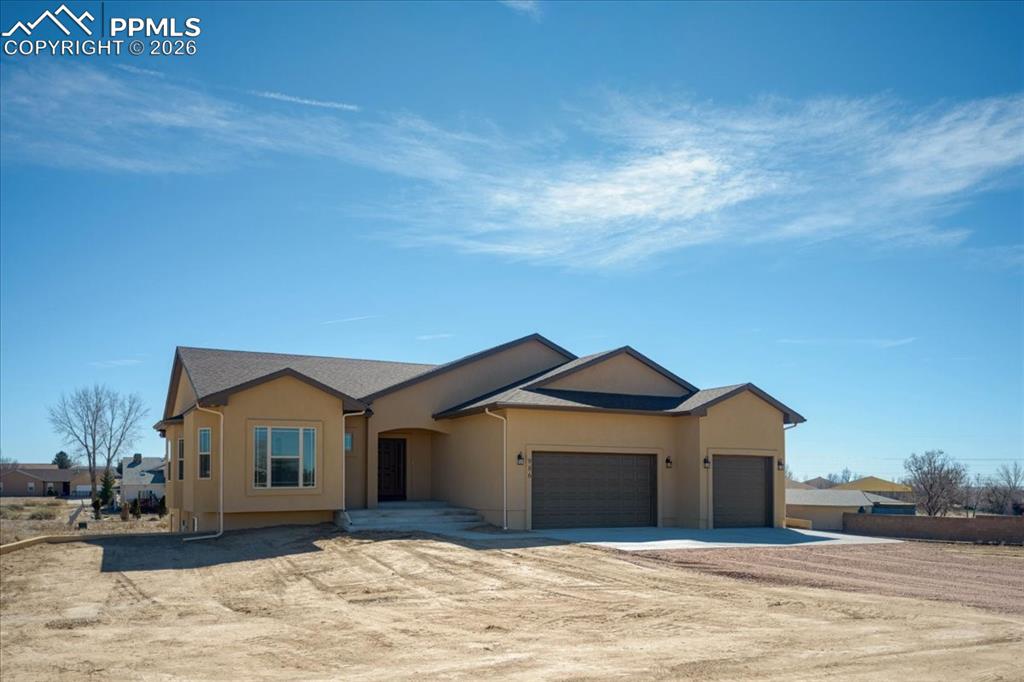 Located in an established quiet neighborhood with mountain views, this unique new custom-built ranch home offers the perfect blend of privacy, convenience, and modern amenities. Enjoy relaxing evenings on the covered back patio or entertain guests in the spacious living area that seamlessly connects to a gourmet kitchen. This residence is minutes from Lake Pueblo State Park, making it ideal for families or anyone seeking a tranquil, community-oriented location. Step inside to discover a bright and spacious open layout filled with premium upgrades, including granite countertops in both the kitchen and bathrooms, soft-close cabinetry, and two electric fireplaces that create a warm, inviting atmosphere. Additional features include vaulted ceilings that enhance the sense of openness, walk-in closets for ample storage, a luxurious freestanding soaking tub in the master bathroom, a walk-in master shower, and an upgraded tile shower in the second bathroom. Luxury vinyl plank (LVP) flooring runs throughout the living room, kitchen, entry, and bathrooms, ensuring both style and durability. The home also boasts stainless steel appliances, an attractive acrylic stucco exterior, and an oversized third garage stall, perfect for extra storage, boat, or a workshop. For added efficiency, a tankless water heater is included. This custom-built ranch home features 9’ ceilings in the unfinished basement, providing endless possibilities for future customization. With thoughtfully designed spaces. Scheduled for completion around 03/16/2026, photos and virtual tour represent a similar built home.