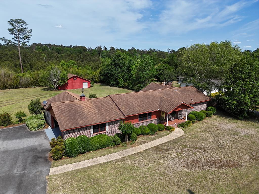 Beautifully CLASSIC home on Metcalf Rd. in Thomasville, GA! This 3BR/2Bath home is spacious, functional, and full of charm! Inside you will find a wonderfully rustic fireside den, great kitchen and dining area, formal living room, great primary suite with walk-in closet, and cute bedrooms. Additions to the house include two nice rooms that have been used as a salon and sewing parlor - PERFECT for your hobbies and crafts, or as extra bedrooms. Outside you will find a nice barn, lovely gazebo, fire pit, and wonderful covered back porch, all on a HUGE 1-acre property. Call your favorite agent TODAY for a closer look at this beautiful home! Click here for virtual tour: https://my.matterport.com/show/?m=uXyNC2b8CVt&mls=1