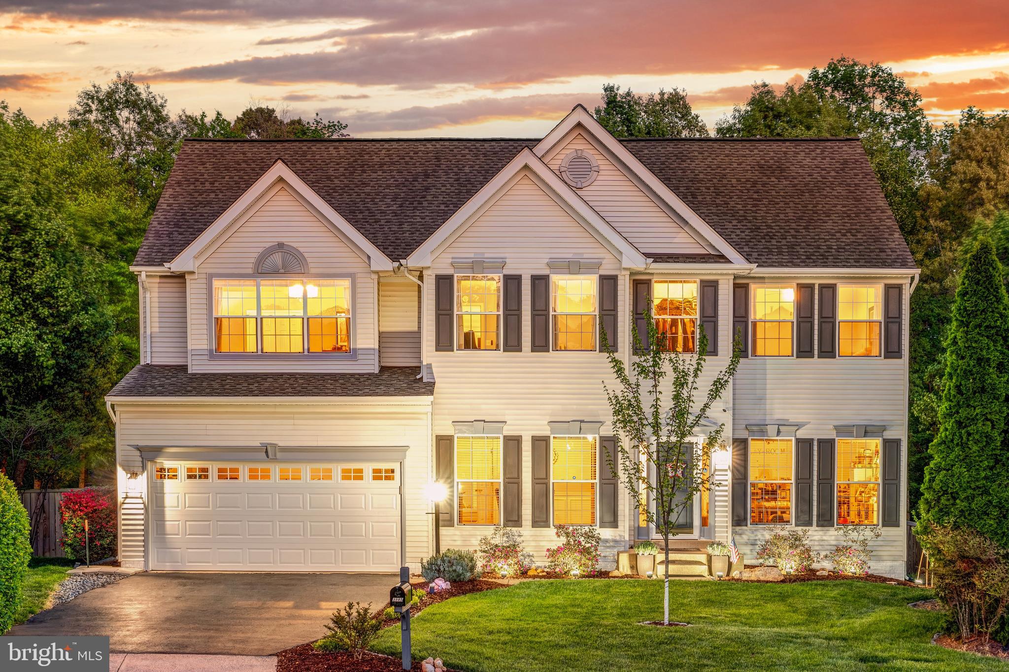 Welcome home. From the moment you turn onto our quiet cul de sac, with no through traffic and a front yard made for kids on bikes, you feel it, this is simply the best homesite in the whole community, stately and full of curb appeal. Step inside and the formal living and dining rooms greet you with a sense of occasion, the kind of rooms where holidays become memories, before the wood floors lead you back to the heart of it all: a kitchen that became the true gathering place of our family, with its huge island where three people can sit and talk while dinner comes together, the double wall ovens and glass cooktop for the cook who never wants to compromise, and windows over the sink that let us watch the kids play in the tree lined yard while we did dishes. A four foot extension across every level gives this home a sense of scale and smart, thoughtful layout you feel the moment you walk through it, and that kitchen opens right into a family room with two story ceilings and a wall of windows that fills the whole space with light, and on cool evenings we would light the gas fireplace under its stone surround floor to ceiling and just be together. Off the breakfast area, the slider leads to our deck, and from there down to a backyard that has genuinely felt like our own private retreat, lush and green, lined with trees, host to countless birthday parties, summer nights in the hot tub, and lazy afternoons watching the dogs run. The lower patio with its built in firepit and seating wall became our favorite spot for fall evenings with friends. Upstairs, our primary suite feels like an escape all its own, with cathedral ceilings, hardwood floors, a walk in closet, and a spa like bath with a seamless glass shower and a soaking tub we used to unwind in after long days, while three more good sized bedrooms and a laundry room round out that level, with a catwalk that lets you look down into the family room below. We loved that the main level bedroom and full bath gave us a place for aging parents or guests to stay comfortably without stairs, and the finished walkout lower level, with its rec room, game area, and guest suite with its own full bath, gave everyone room to spread out and still come together. With over 4750 square feet across three levels, five bedrooms, four full baths, a two car garage, and thoughtful updates throughout including a newer roof, HVAC, water heater, and windows, this home has taken care of us the way we hope it will take care of whoever is lucky enough to call it theirs next. We raised our family here, and location made everyday life easy too, with convenient access to I-95, Route 1, and Route 234, quick reach to Quantico, public transportation options to Washington D.C., the Pentagon, and Fort Belvoir, and the VRE station, Potomac Mills, Wegmans, and great restaurants all nearby.
