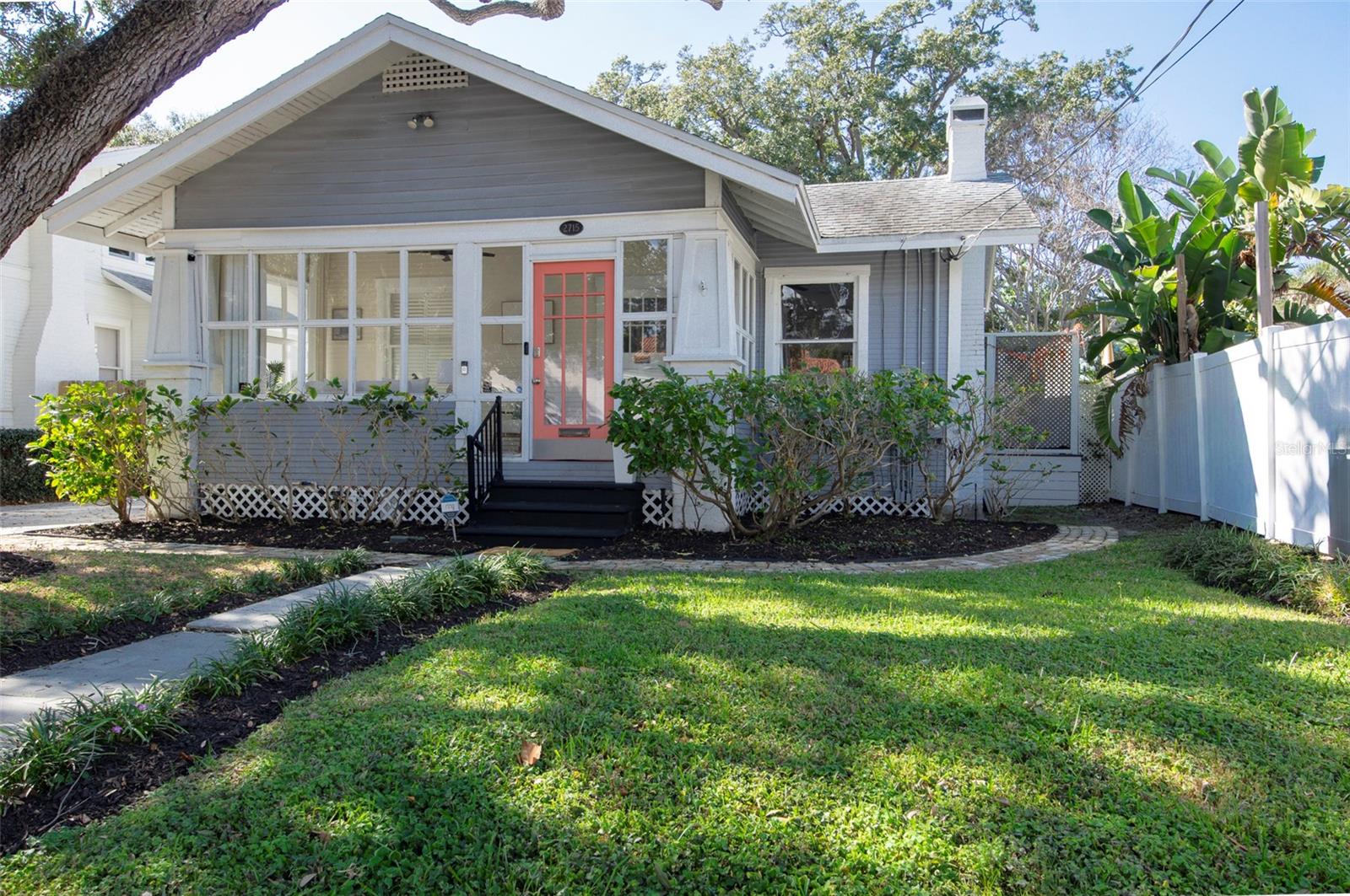 This well-maintained 1922 bungalow is located on a charming brick-lined street in the highly desirable Palma Ceia Park neighborhood, within the sought-after Plant High School district. The property is located in FEMA Flood Zone X, and no flood insurance is required. Seller reports no flood damage during recent storms, including Hurricanes Helene and Milton. The home offers an exceptional walkable lifestyle, just a short stroll to Bayshore Boulevard as well as the restaurants, cafés, and shops along Bay to Bay Boulevard and MacDill Avenue, including neighborhood favorites such as Buddy Brew Coffee and Chill Bros Ice Cream. Inside, the home is filled with abundant natural light from large windows throughout, creating a bright and welcoming atmosphere. Timeless architectural details include crown molding throughout the home and built-in bookshelves that add both character and functionality. French doors open to a lattice-enclosed deck, providing a comfortable space for outdoor dining, relaxing, or entertaining year-round. The primary bedroom suite and second bedroom both feature sizable closets and custom plantation shutters, offering privacy and classic style. The second bathroom includes a beautiful antique clawfoot bathtub that adds historic charm and elegance to the space. Significant recent updates provide peace of mind, including a brand new high-end HVAC system installed in 2024 and structural enhancements completed in 2021. Termite treatment is professionally maintained on a monthly preventative basis, and the mature trees on the property are routinely monitored and trimmed. Outside, the fenced-in yard provides privacy and flexibility for outdoor living. A storage shed offers additional convenience, while the long driveway extends from the front of the property all the way to the back, a rare and valuable feature for the area. This classic South Tampa bungalow offers historic charm, thoughtful maintenance, an unbeatable location, and modern upgrades in one of the city’s most beloved neighborhoods.