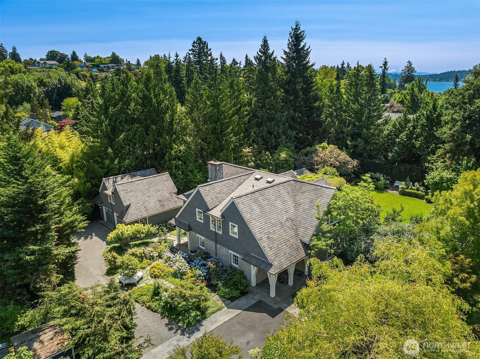 Aerial view showcasing the home's private, tree-lined setting.