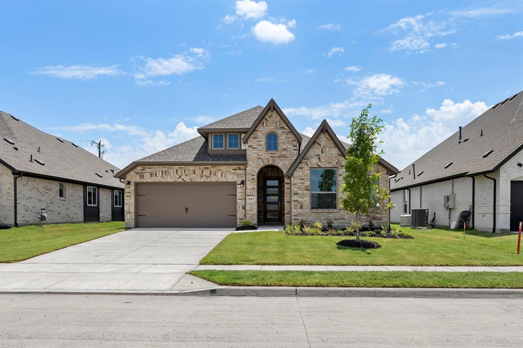 MLS# 21302048 - Built by Pacesetter Homes - Ready Now! ~ Discover 805 Trinity Street featuring the spacious Southlake floor plan, designed as a convenient one-story home. This residence includes a tandem 3-car garage and a covered patio, perfect for both everyday living and entertaining, with extended flatwork off the back patio for added outdoor living space. The deluxe kitchen is thoughtfully appointed with double ovens, stainless steel appliances, granite countertops, 36? cabinets, under cabinet lighting, and blinds throughout the home. Pendant lighting over the kitchen island and added LED disk lighting enhance both style and functionality, while brushed nickel light fixtures provide a cohesive, modern touch throughout. The private master suite offers a relaxing retreat with a master shower that includes a built-in seat. Additional features like full gutters complete this well-rounded home.