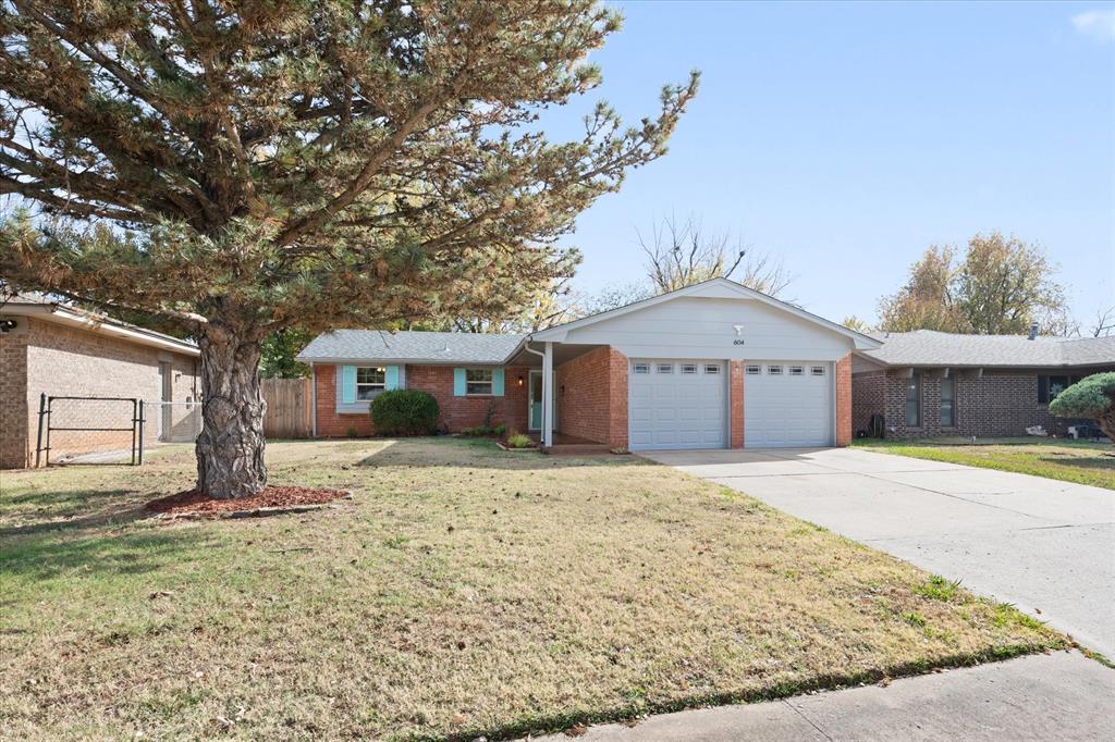 Welcome to this beautifully redesigned, open-concept home located in the desirable Meadow Lakes community of Edmond at 604 Willow Ridge Lane. This property has been thoughtfully and extensively remodeled, offering a modern look and feel while maintaining comfort, function, and style throughout. You’ll appreciate the spacious layout, natural light, and attention to detail that elevate every room. The expansive living room flows effortlessly into the dining area and the newly completed kitchen, creating a true “heart of the home” gathering space. The kitchen is a standout feature with its custom-built cabinetry, quartz countertops, and a large island accented with pendant lighting—perfect for meal prep, casual dining, or conversation. The appliance package includes a 5-burner gas range, double ovens, built-in microwave, and refrigerator with icemaker, providing a chef-friendly setup with both style and functionality in mind.  The primary bedroom includes a generously sized closet and a beautifully remodeled en-suite bathroom. The updated vanity with a basin sink adds a modern design element, complemented by stylish finishes throughout. The two secondary bedrooms offer ample space, large closets, and ceiling fans, making them comfortable and functional for a variety of needs such as guest rooms, or office space. This home offers an impressive list of major improvements. A brand-new HVAC system has been installed, complete with new ducts and vents for comfort and efficiency. A new stockade fence with steel posts encloses the backyard, offering privacy and low maintenance. The roof was replaced approximately five years ago. Newly installed windows bring in abundant natural light and contribute to energy efficiency. Recessed lighting has been added in the kitchen and main living area, giving the space a bright, modern feel. Tile flooring flows through the entire home. New garage doors and openers. An exceptional opportunity you won’t want to miss!  Welcome Home.