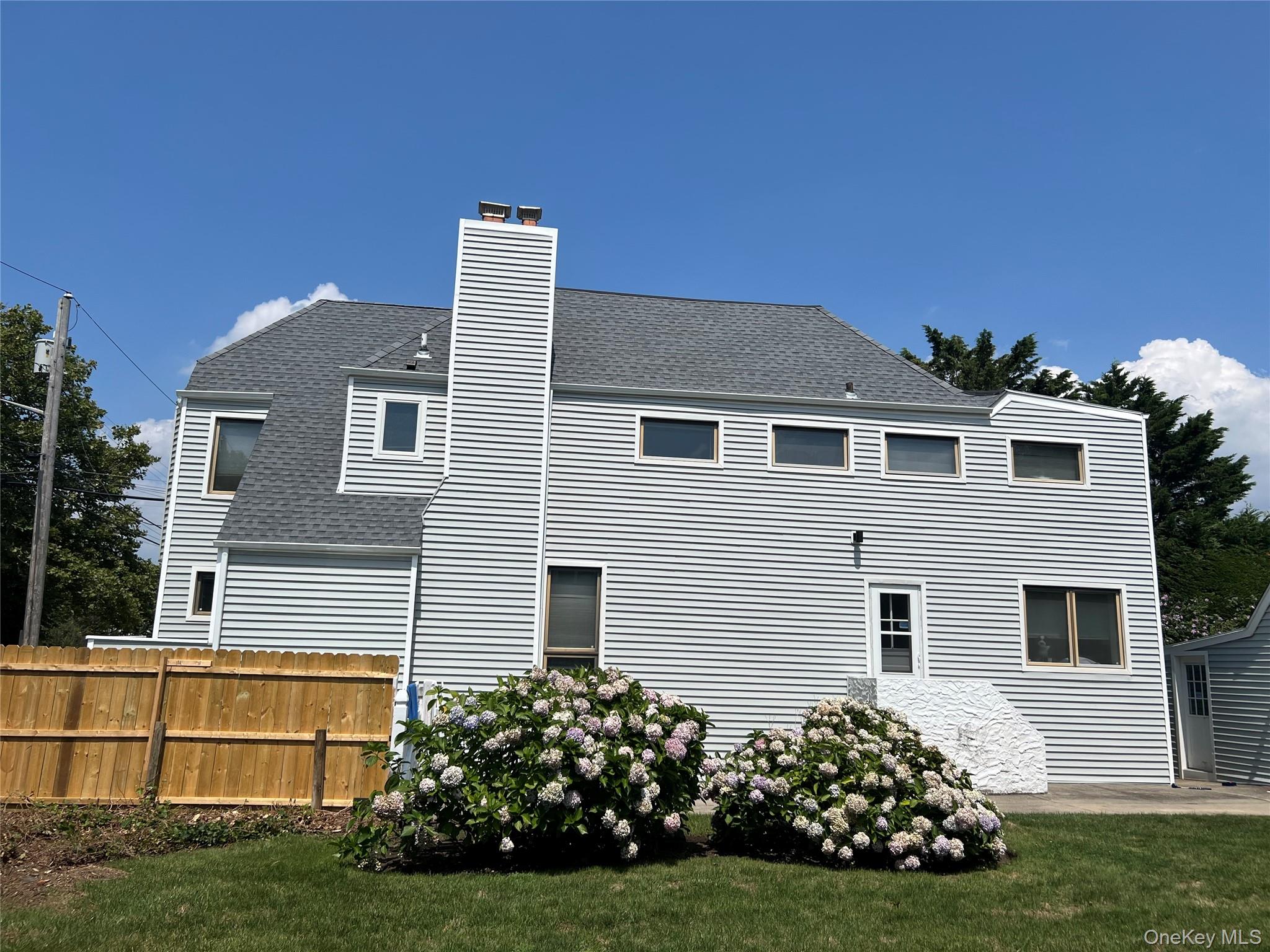 Rare Ocean-Block Opportunity in In-Demand Atlantic Beach Realize your architectural aspirations on this oversized 7,000+ sq ft lot (82.5' x 85.15') situated on a highly coveted beach block. Offering an unparalleled entry point into an exclusive coastal community, this property is located just 30 minutes from JFK and 45 minutes from Manhattan. Current zoning allows for up to 2,137 sq ft per floor, paving the way for a magnificent custom home exceeding 4,000 sq ft - with ample room for a private pool and an active gas line already on site, ideal for pool heating and outdoor living. The existing 2,000+ sq ft structure spans two levels with hardwood floors, a basement, and a stand-alone garage, offered entirely as-is for custom renovation or complete new construction. Bring your own vision, or collaborate directly with the seller, a premier local developer ready to design and construct your ultimate dream home. An exceptional lifestyle opportunity awaits. Offered at $2,100,00.