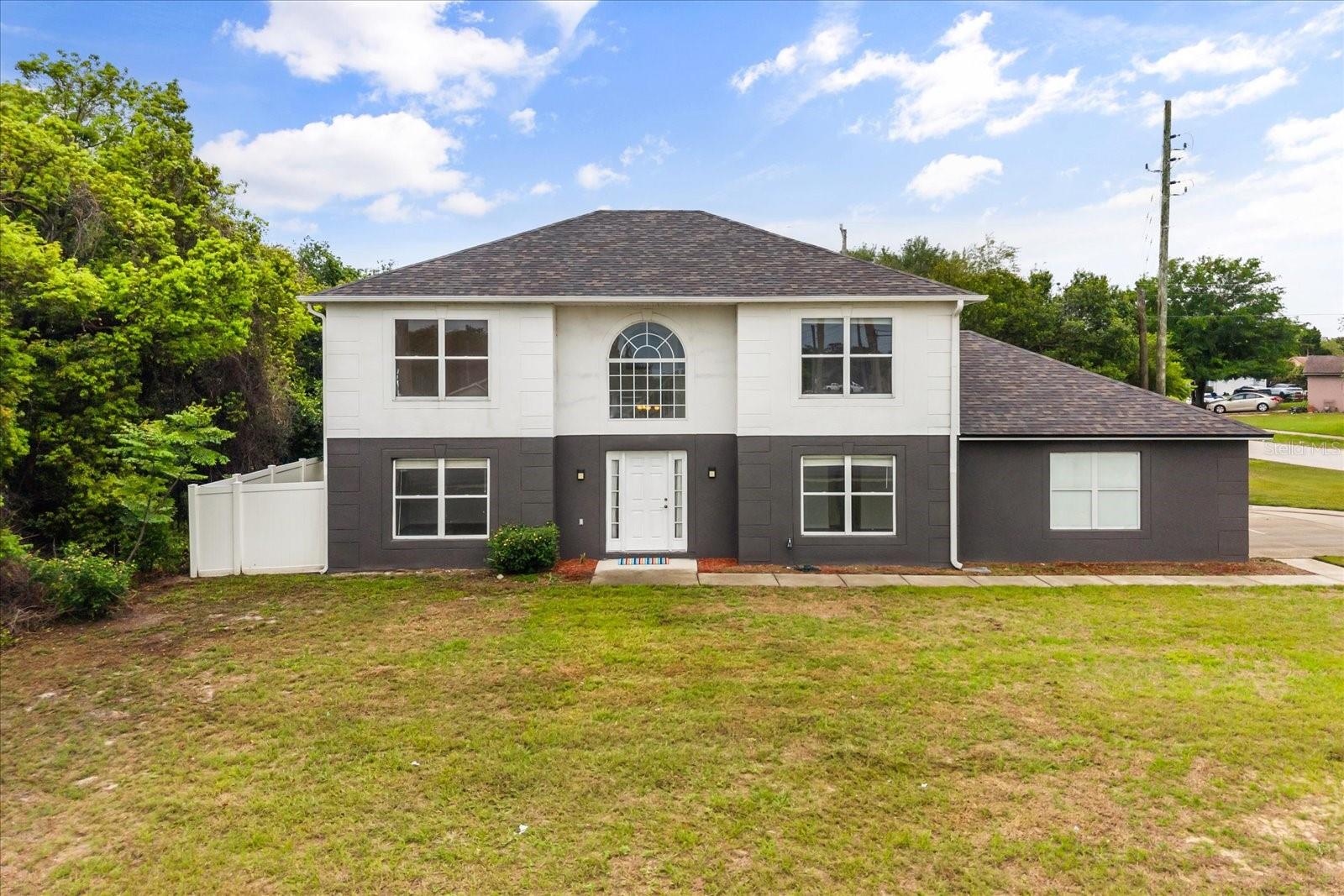 One or more photo(s) has been virtually staged. Welcome to 1780 Howland Blvd in Deltona, FL—a spacious and well-maintained two-story home offering 4 bedrooms, 2.5 bathrooms, and over 2,300sqft of living space on a 0.27-acre corner lot with NO HOA. Step inside to an open-concept layout filled with natural light, featuring separate living and dining areas that flow seamlessly—ideal for both everyday living and entertaining. The kitchen offers ample cabinet storage, functional counter space, and essential appliances, making it practical and efficient. Upstairs, all bedrooms are thoughtfully positioned for privacy. The large primary suite provides a comfortable retreat, while the additional bedrooms are perfect for family, guests, or a home office. Key Features & Upgrades: NEW ROOF (2025), Block construction (durable & energy efficient), Central AC & heating, 3-car garage, Laminate flooring in all rooms and Rain gutters were added. Enjoy the benefits of a large fenced corner lot with endless potential—add a pool, outdoor kitchen, patio, or garden. Plenty of room for RV, boat, or trailer parking thanks to NO HOA restrictions. Conveniently located near shopping, dining, schools, parks, and just minutes to I-4, providing easy access to Orlando, Sanford, and Daytona Beach. Ideal for first-time buyers, growing families, or investors seeking a strong rental opportunity in a rapidly growing Central Florida market. Schedule your private showing today.