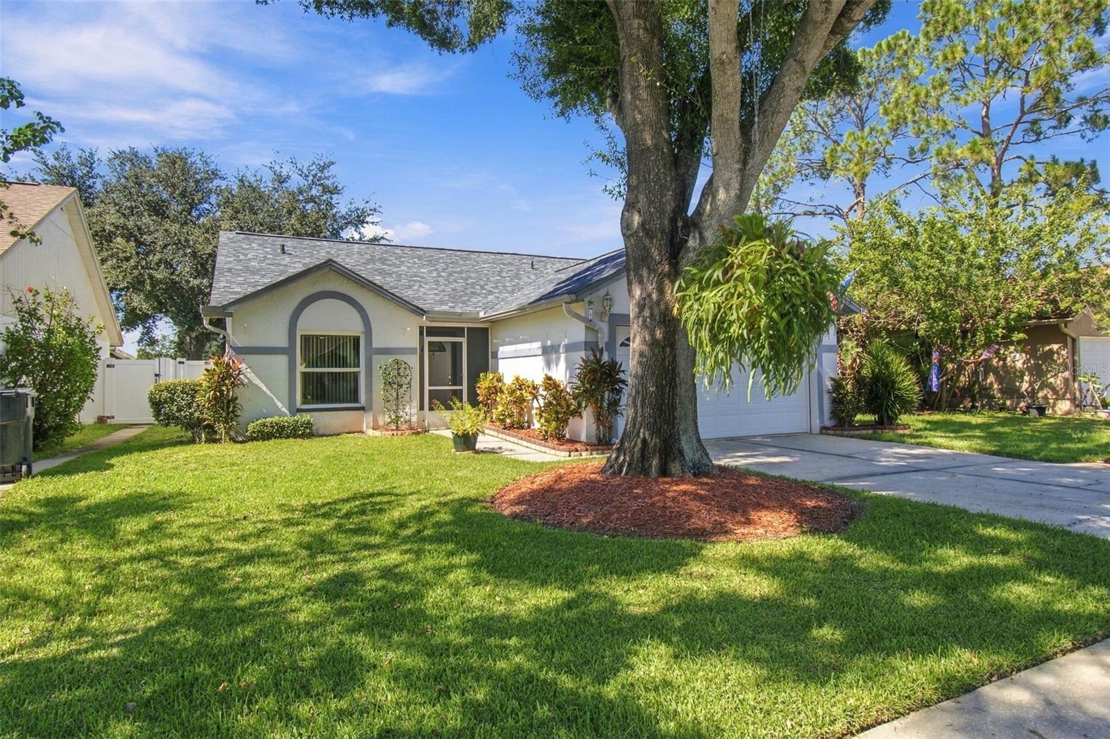 **MOVE-IN READY LAKEFRONT HOME WITH BEAUTIFUL UPGRADES AND PEACEFUL WATER VIEWS!** Welcome to 1710 Tarah Trace Drive, a beautifully maintained home situated on Glass Lake in Brandon! This inviting property offers a wonderful combination of comfort, functionality, and thoughtful improvements throughout. Enjoy peace of mind with a **NEW ROOF INSTALLED IN 2026**, updated A/C system 2024, upgraded 150-amp electrical panel, water heater 2019, updated plumbing throughout the home, replacement hurricane-rated windows, upgraded sliding glass doors, and a reinforced garage door. Step inside through the screened front porch and tiled entryway to discover a spacious living room featuring vaulted ceilings and a comfortable, open feel. The beautifully remodeled kitchen (2017) is sure to impress with its solid wood cabinetry, gorgeous quartz countertops, decorative tile backsplash, recessed lighting, and tongue-and-groove luxury vinyl flooring. Designed with both style and convenience in mind, the kitchen features a built-in spice rack, pull-out trash cabinet, multi-tier pull-out storage organizers, countertop-mounted garbage disposal control, and a dedicated coffee and wine bar. The updated range includes an air-fryer oven, and **ALL APPLIANCES CONVEY!** The primary bedroom features vaulted ceilings, a walk-in closet with additional storage features, and convenient access to a private bathroom with tiled flooring and a tub/shower combination. Additional storage includes a linen closet with pull-out drawers. The second bedroom offers built-in storage, while the third bedroom features mirrored closet doors. A hallway linen closet provides additional convenience, and the second bathroom includes a tiled tub/shower combination. Step outside and enjoy the peaceful surroundings of **GLASS LAKE!** The backyard features privacy fencing, gates on both sides of the home, and a dedicated grilling pad, offering a wonderful setting for outdoor enjoyment. Additional features include an irrigation system, gutters, and downspouts. With its beautiful lakefront location, extensive improvements, thoughtfully remodeled kitchen, and move-in-ready condition, this home offers an exceptional opportunity to enjoy Florida living. **CONVENIENT BRANDON LOCATION!** Enjoy easy access to major roadways, including I-75, I-4, State Road 60, U.S. Highway 301 and the Selmon Expressway, connecting you to Tampa, Riverview, Lakeland and surrounding communities. Conveniently located near shopping, grocery stores, restaurants, medical facilities and entertainment. Nearby destinations include Publix, ALDI, Walmart, Brandon Exchange, HCA Florida Brandon Hospital and numerous local dining options. Enjoy the convenience of an established Brandon neighborhood with everyday necessities just a short drive away!**Schedule your private showing today and discover all this wonderful property has!**