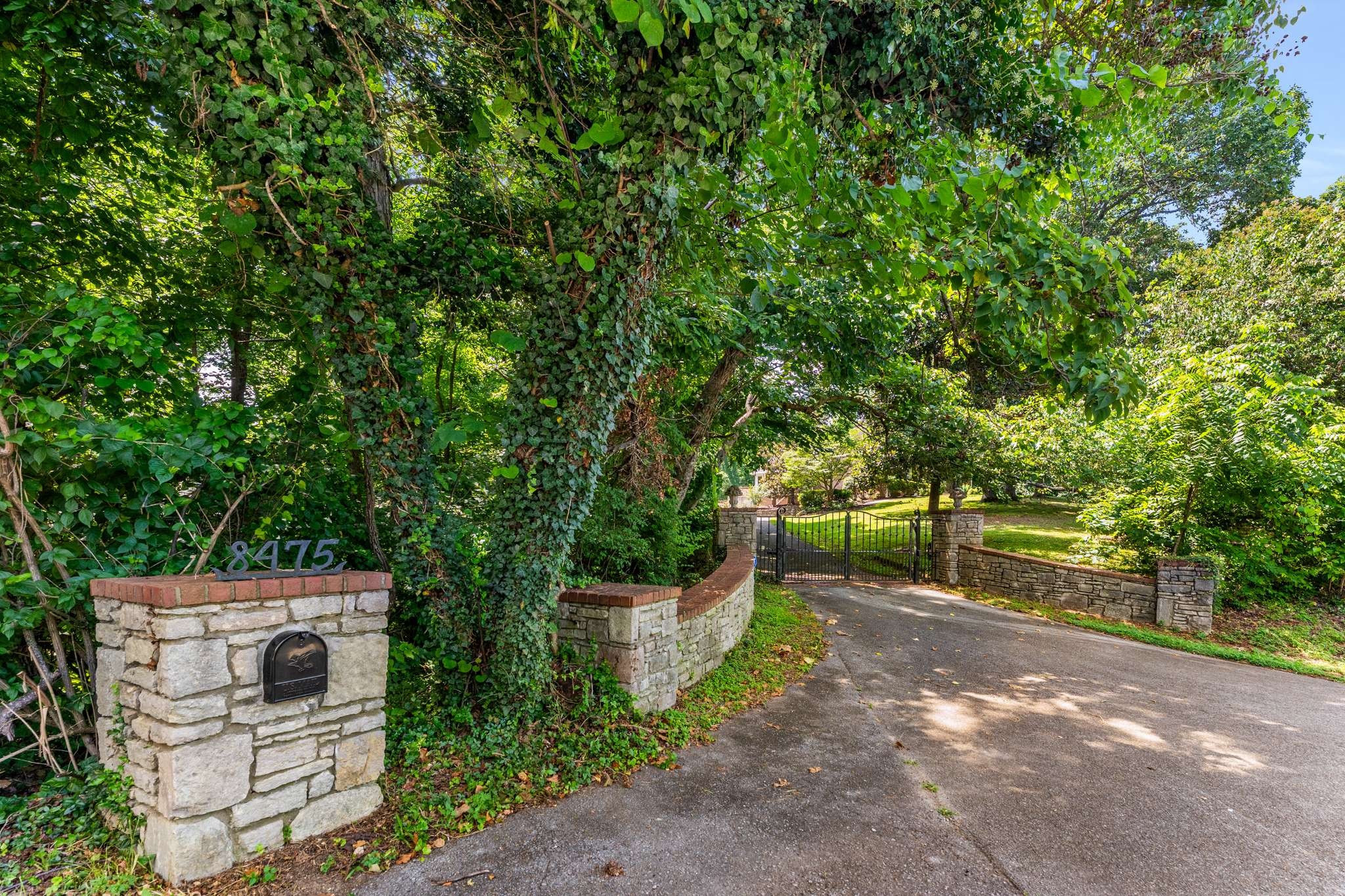 Discover the perfect blend of privacy and convenience in this gated home nestled on over five acres tucked away with hillside views. Enjoy the best of both worlds—peaceful seclusion just minutes from all the amenities the area has to offer. This beautifully designed home features 3 spacious bedrooms and 2 full bathrooms. The open-concept eat-in kitchen flows seamlessly into the great room, creating an ideal space for entertaining and everyday living. Upstairs, you'll find a versatile bonus area perfect for a second living room, office, or playroom. The primary suite offers a large walk-in closet, laundry area, and direct access to the outdoors. Step into the sunroom and out onto a spacious deck overlooking the pool and lush greenery—your own private retreat. Additionally, the property includes a guest house complete with 1 bedroom, 1 bathroom, a kitchen, and a sunroom with views of nature. New carpet and freshly painted.