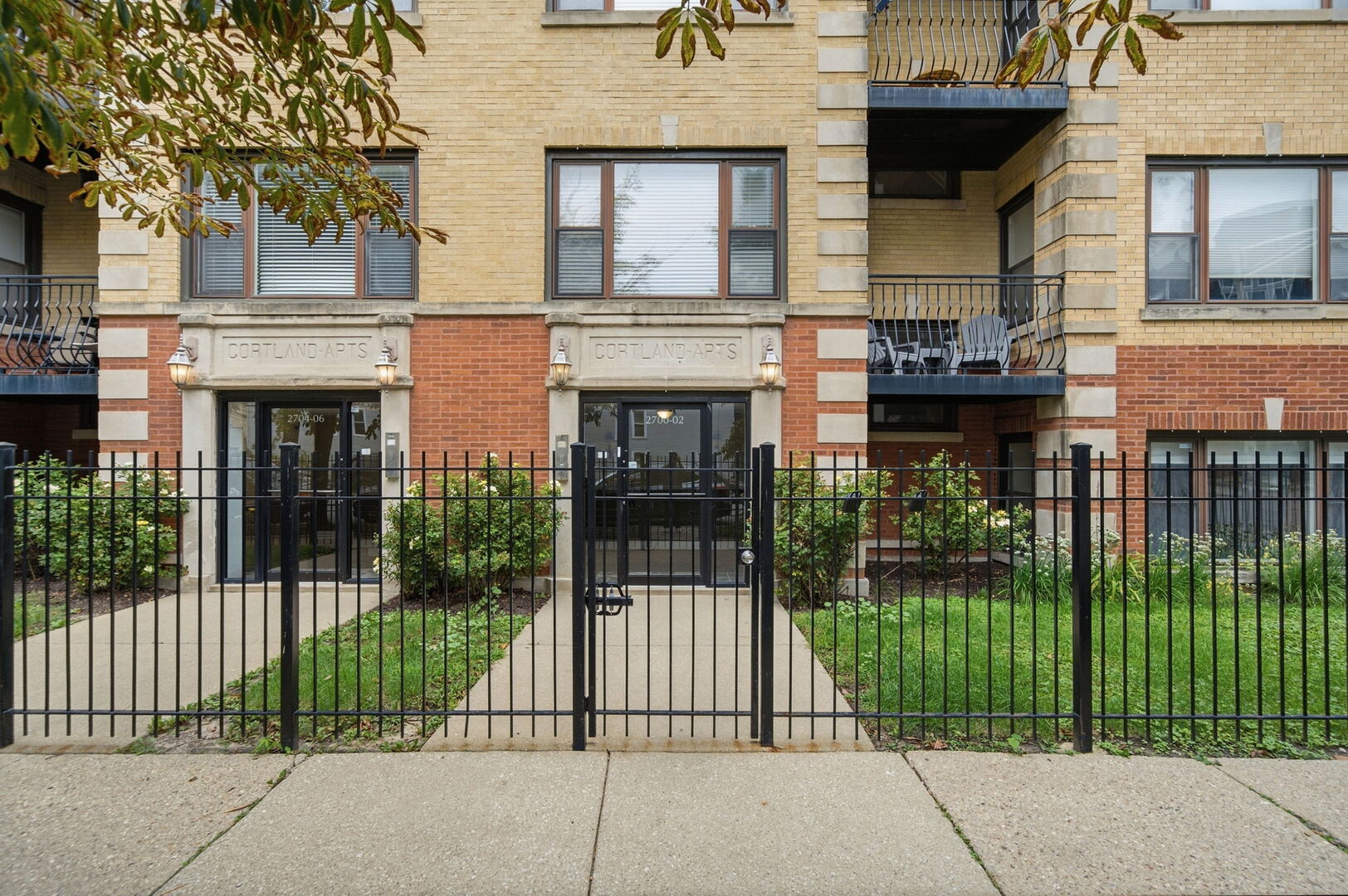 Welcome home to this HUGE and inviting 2-bedroom, 2-bath English garden in a beautifully maintained vintage Chicago brick 20-unit building in walkable Logan Square!    At approximately 1,800 square feet, this incredibly spacious split-bedroom home gets wonderful east and south light and has room for all your friends, hobbies and activities. The layout is flexible and comfortable, with a separate dining room that is absolutely begging for potlucks, game nights and dinners with friends.    The extra-large primary bedroom is a dream! There is so much room to create the bedroom you've always wanted - think dressing room, sit-down vanity, Peloton/workout area, reading nook and MORE. The second bedroom is also generously sized and flexible enough for guests, a home office, workout space or creative studio.    Cherry hardwood floors run throughout, and the home has been recently painted, making it easy to move right in and make it your own.    And then there is the WOW outdoor space! Tucked beneath the building is a huge covered area with exposed brick walls, dramatic wood-and-steel architectural details and a surprisingly private feel. This is so much more than a typical condo outdoor space - create an outdoor lounge, dining area, garden retreat, entertaining space or your favorite place to hang out on a summer evening. The possibilities are endless!    The building itself has loads of vintage Chicago character, with classic brick architecture, mature landscaping and handsome iron fencing. And the location? So good. Walk just two blocks to Logan Square's restaurant row for dinner, drinks, coffee and neighborhood favorites, or head straight down Cortland toward the Western Blue Line for an easy commute.    With an enormous amount of living space, a flexible two-bedroom layout, two full baths, beautiful cherry floors, great natural light and an outdoor area that is truly one-of-a-kind, this is not your typical garden condo.    Big, bright, flexible and full of possibilities - all in a fantastic Logan Square location. Come see it!