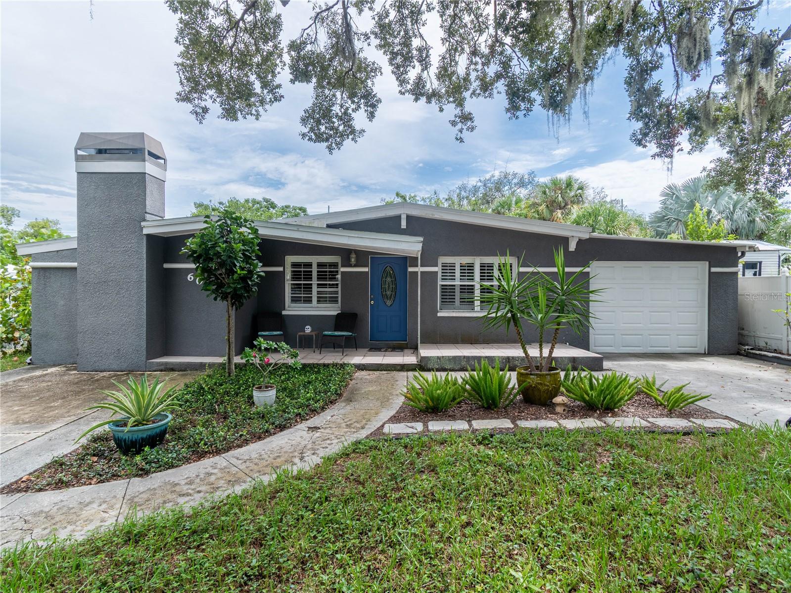 RARE FIND in the heart of Tarpon Springs! This unique 3-bedroom, 2-bath home offers an exceptional combination of character, space, and location just moments from historic Downtown Tarpon Springs and the world-famous Sponge Docks.One of the home's standout features is the impressive 12' x 50' pass-through garage, providing incredible space for vehicles, a boat, workshop, storage, or hobbies. The home has 2 driveways and sits on a generous 163' deep lot with a spacious backyard, featuring a 12' x 23' gazebo and an expansive 11' x 35' covered back porch perfect for relaxing, entertaining, and enjoying the Florida lifestyle.Inside, the updated kitchen features granite countertops, stainless steel appliances, and pecan wood cabinetry. Vaulted ceilings enhance both the living room and the spacious primary suite, which includes a wood-burning fireplace, and a walk-in closet.Major improvements include a new roof installed in 2019 and a brand-new HVAC system installed in 2026. The home has also recently passed a 4-point inspection, and the seller is offering a Home Warranty for additional peace of mind for the next owner.Enjoy the convenience of being close to the restaurants, breweries, shops, festivals, waterfront attractions, and small-town charm that make Tarpon Springs such a special place to call home. With its oversized pass-through garage, deep lot, outdoor living spaces, major system updates, and unbeatable location, 608 Pent Street is a property you won't find every day!