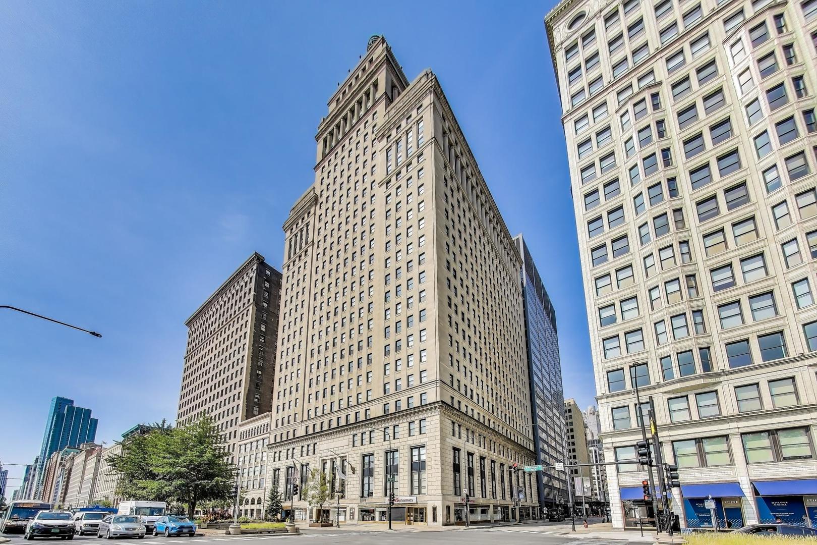 Experience city living at its finest in this stunning 3 bed, 2 bath, 2,100 sq ft duplex in the highly sought-after Metropolitan Tower. With an open floor plan and massive windows overlooking Grant Park, natural light pours into this beautifully updated home. The windows facing Michigan Avenue are double-paned, keeping the space comfortable and quieter than expected. This residence offers private entrances on both levels for ultimate convenience and privacy. Soaring 15-foot ceilings, hardwood floors, and elegant crown molding set the tone for sophisticated living. The updated kitchen boasts granite countertops, high-end appliances, ample cabinet space, and a breakfast bar perfect for casual dining. The main level includes a spacious bedroom and a full bath, ideal for guests or a home office. Upstairs, the oversized primary suite features three closets and a luxurious marble bathroom with double sinks, a soaking tub, and a separate shower. An additional upstairs bedroom offers flexibility for an office, fitness space, or guest room.Tandem parking is located on the same floor as the condo-no long elevator rides with groceries! Residents enjoy a wealth of lifestyle conveniences including a bike room, bike trails, 24-hour door staff, exercise room, health club, on-site manager/engineer, party room, sundeck, receiving room, sauna, steam room, whirlpool, valet/cleaner, storage, service elevator, and security door locks. The common roof deck has been recently updated with new grills (ask for renderings-it's that NEW!).Assessment Includes Heat, air conditioning, water, gas, common insurance, security, doorman, TV/cable, exercise facilities, exterior maintenance, lawn care, scavenger, snow removal, and internet access. Enjoy an unbeatable Loop location, steps from CTA, Lake Shore Drive, Grant Park, the Art Institute, Chicago Symphony, the Chicago River, the lakefront path, and quick access to I-290.